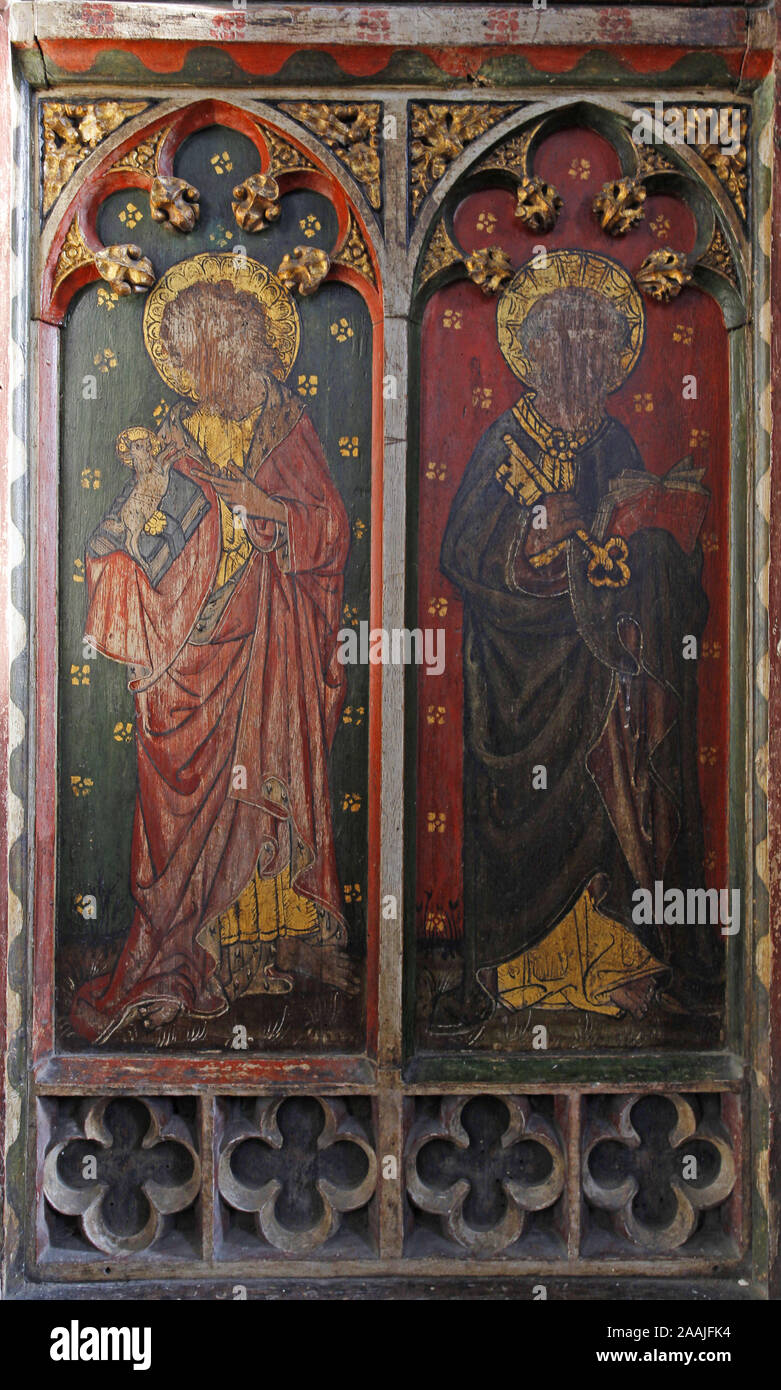 Painted rood screen depicting Ss John the Baptist & Peter, heavily defaced during the iconoclasm of the Civil War, St Peter's Church, Belaugh, Norfolk Stock Photo