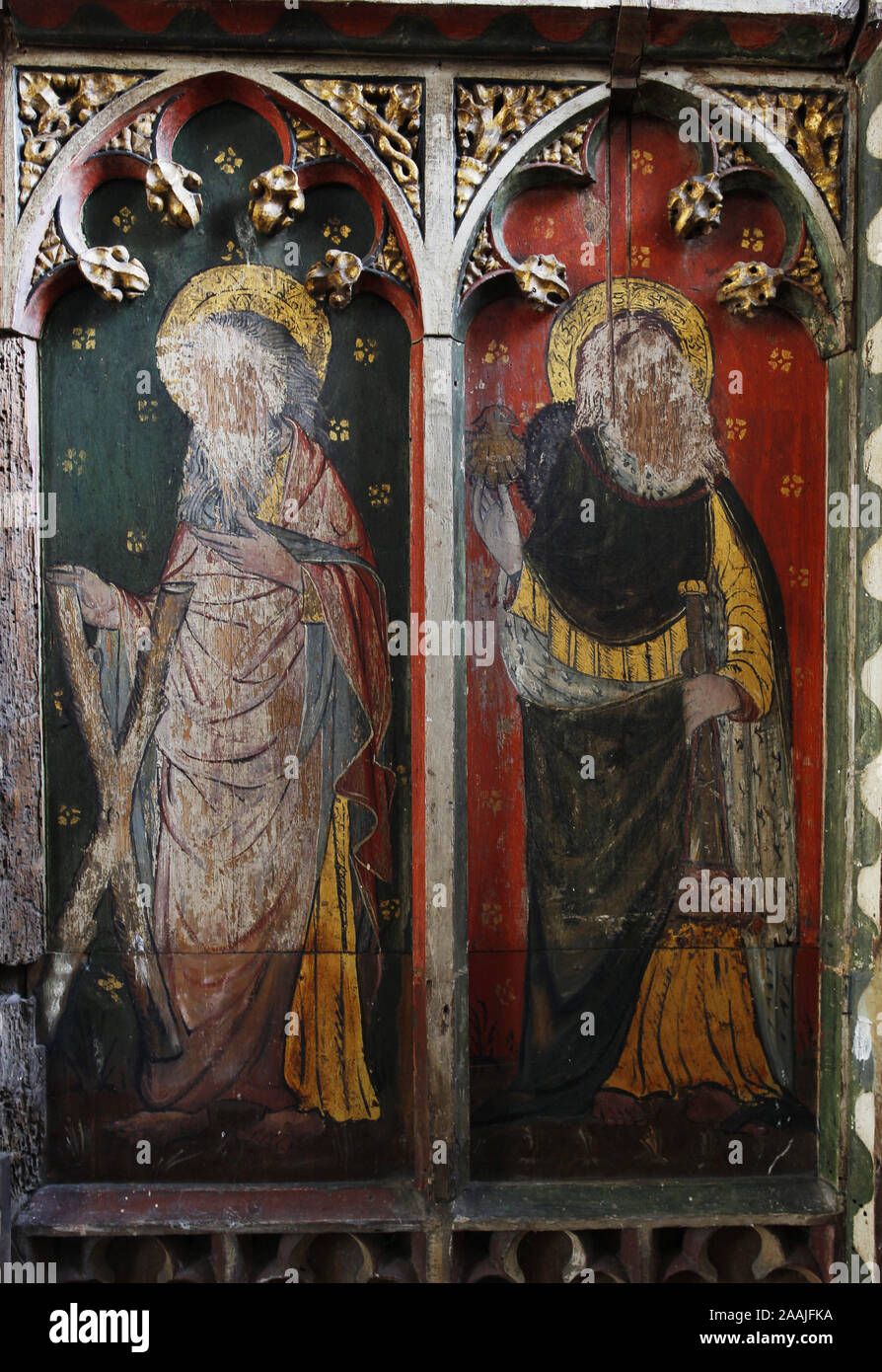 Painted rood screen depicting Ss Andrew & James, heavily defaced during the iconoclasm of the English Civil War, St Peter's Church, Belaugh, Norfolk Stock Photo