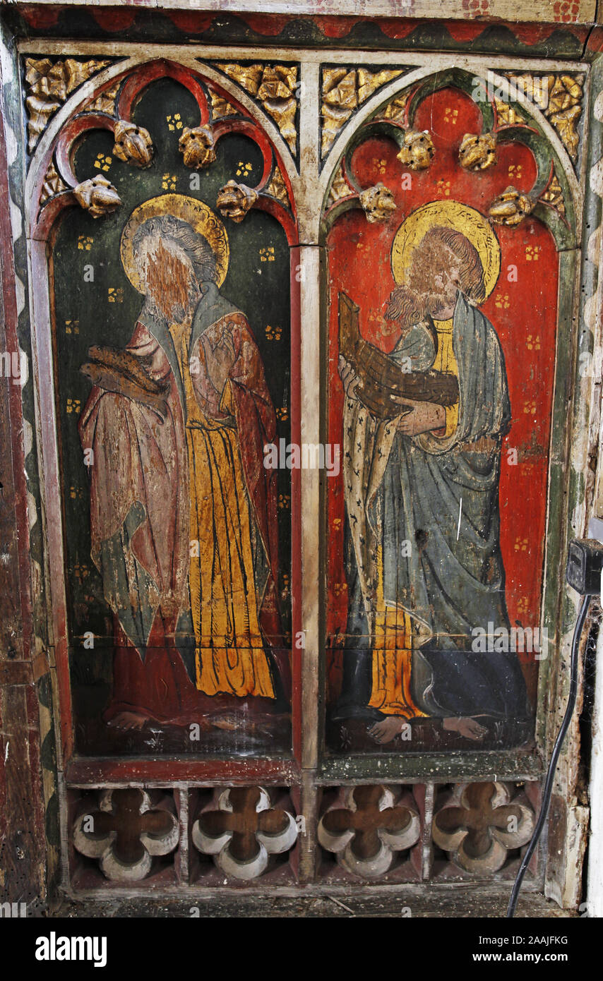 Painted rood screen depicting Ss Simon & Jude, heavily defaced during the iconoclasm of the Civil War, St Peter's Church, Belaugh, Norfolk Stock Photo