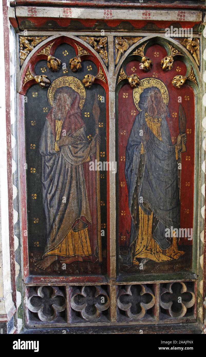 Painted rood screen depicting various Ss, Thomas & Bartholomew heavily defaced during the English Civil War, St Peter's Church, Belaugh, Norfolk Stock Photo