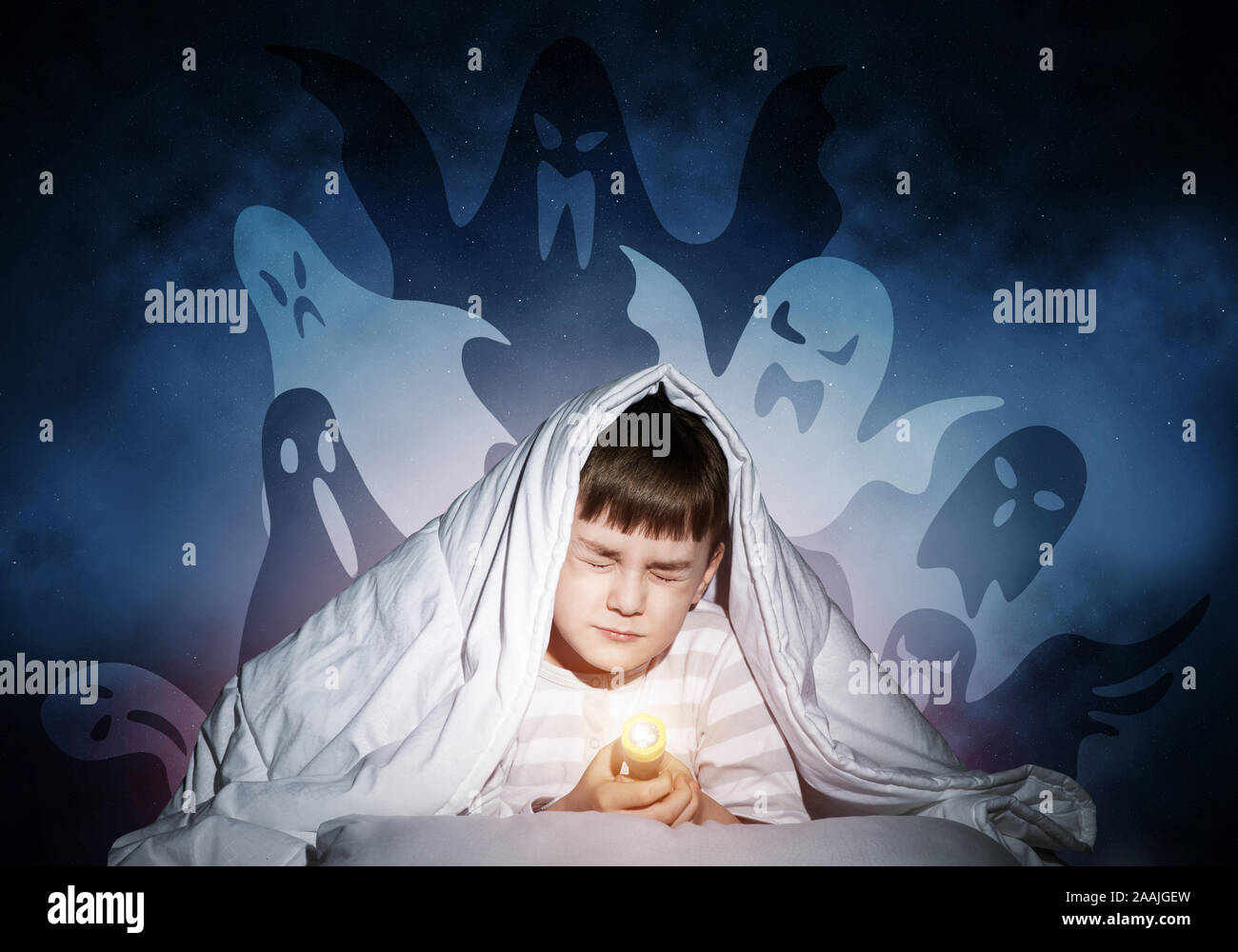 Young boy hiding under blanket Stock Photo Alamy