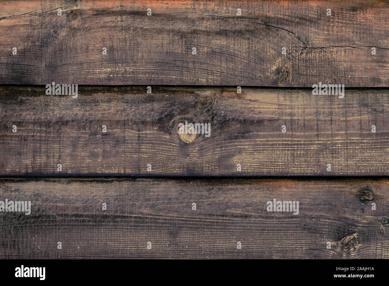 Shabby wooden desk surface. Natural color. Brown wood striped texture. Weathered planks, background. Antique fence, oak boards. Plank - timber. Stock Photo