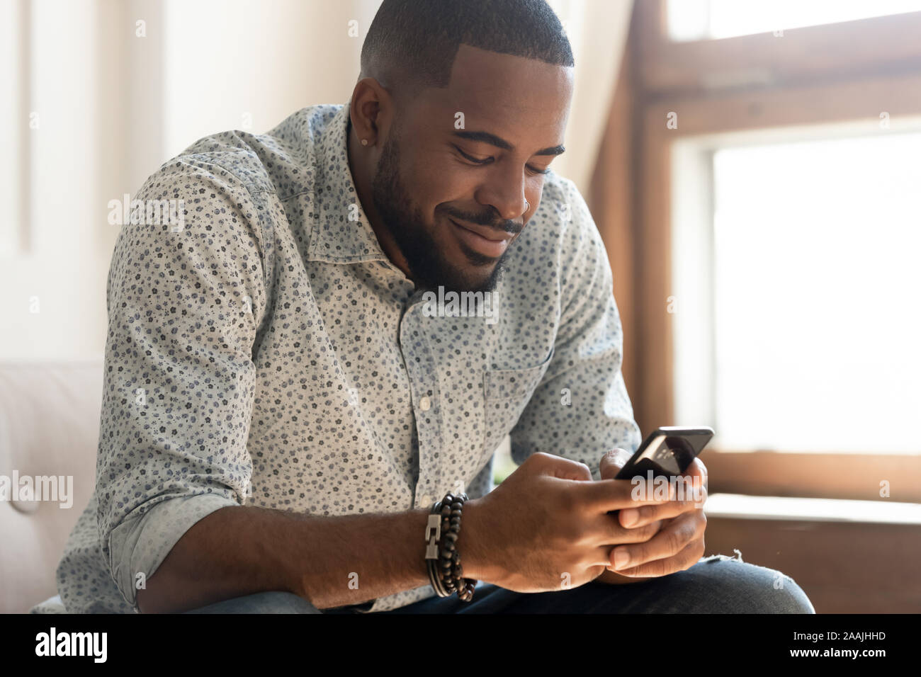 Funny man texting on smartphone hi-res stock photography and images - Alamy