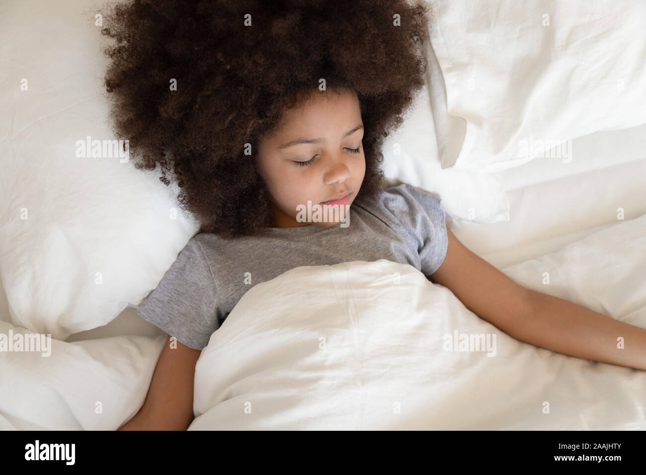 Black girl sleeping in bed hi-res stock photography and images - Alamy