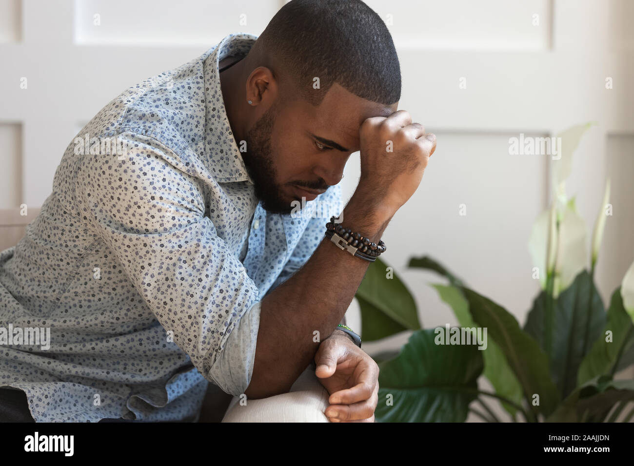 Pensive african American man thinking over problem Stock Photo