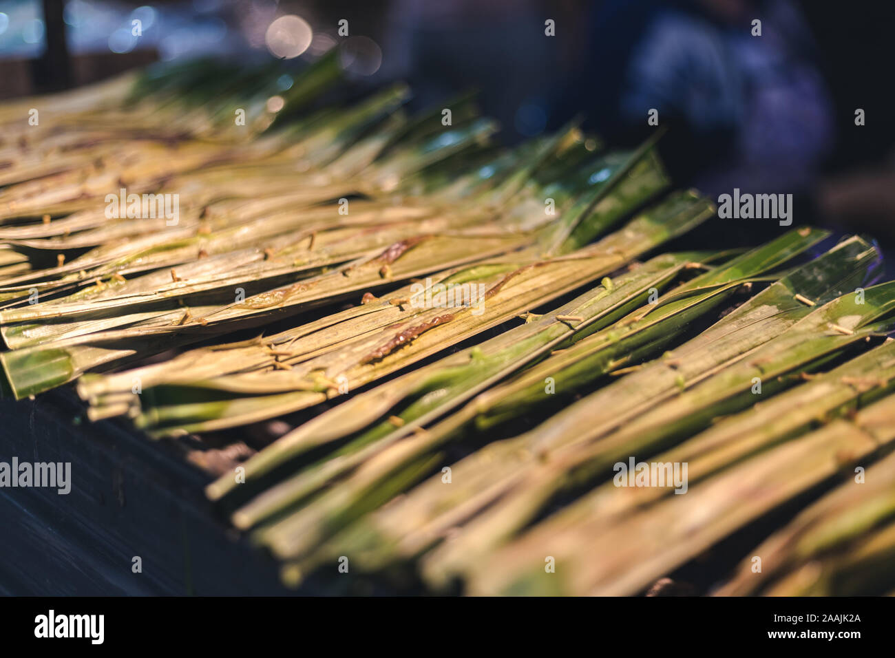 sweet Thai dessert put inside leaves and grill Stock Photo