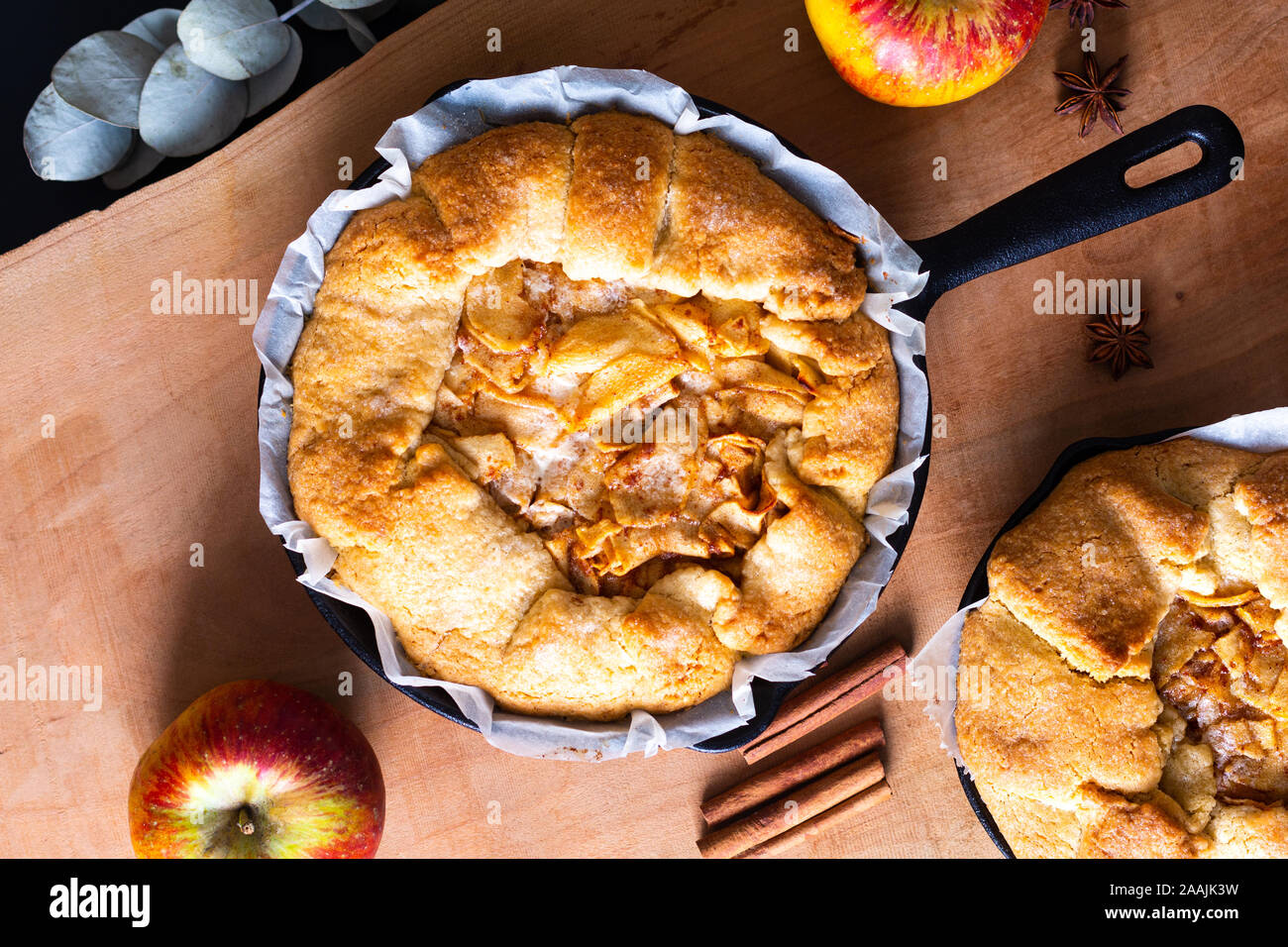 Food concept fresh baked golden Homemade Organic Apple Galette pie buttery crust in iron skillet pan with copy space Stock Photo