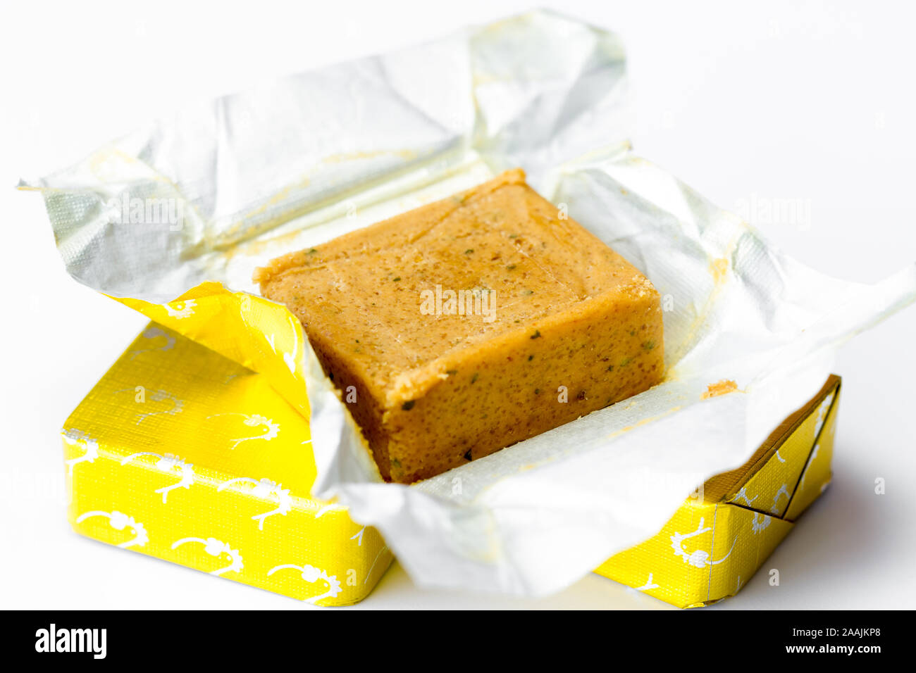 Unwrapped chicken stock cube closeup. UK Stock Photo Alamy