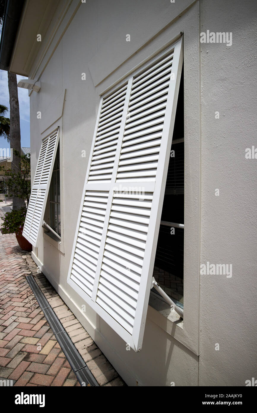 white louvered shutters on windows to reflect sunlight  florida usa Stock Photo