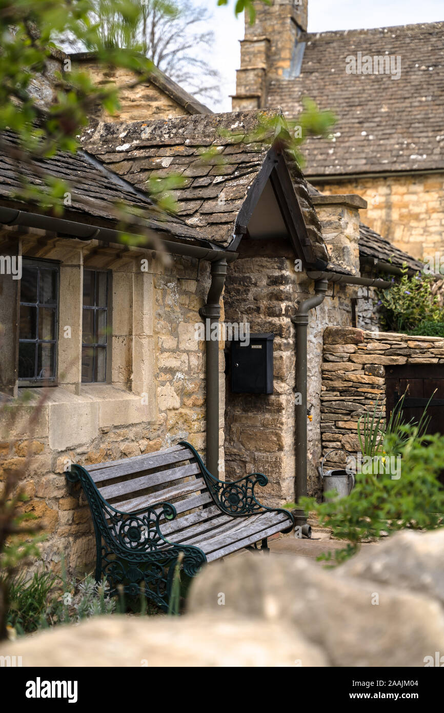 Cute traditional limestone stone houses in rural Britain, England, Cotswolds, United Kingdom. Stock Photo