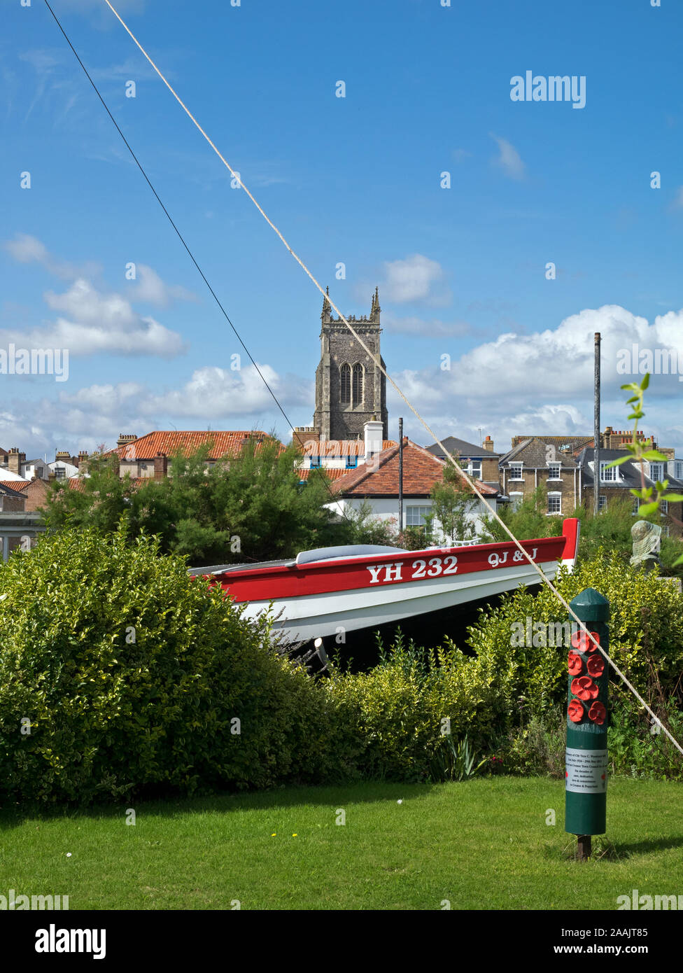 Life-boatman's Henry Blogg's Lifeboat with The Skyline with the Rooftops of Cromer and tower of the parish church of St Peter & Paul, Norfolk, England Stock Photo