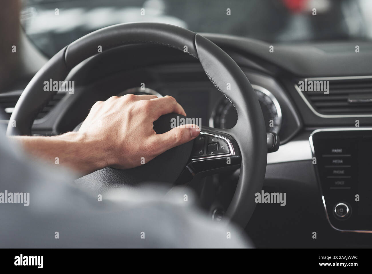 Mans hand steering wheel hi-res stock photography and images - Alamy