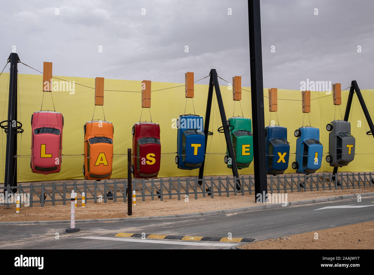 Last Exit sign made with hanging cars at E11 Sheikh Zayed Road, Abu Dhabi, UAE Stock Photo