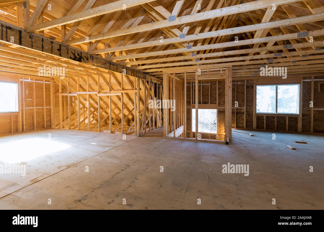 Close-up of beam built home under construction with wooden truss, post and beam framework Stock Photo