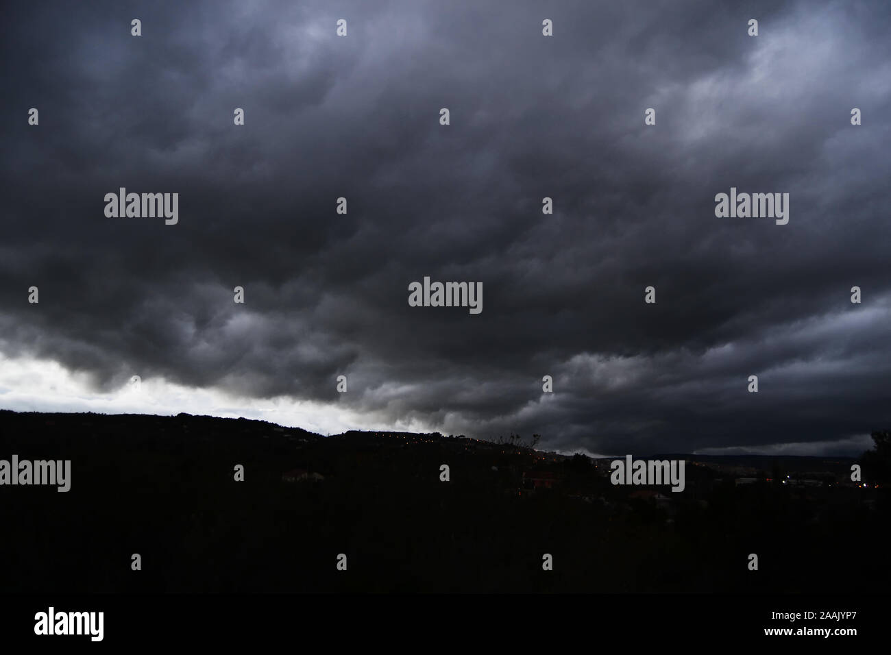Thunderstorm with heavy rains flying over the dark prairie, time frame Stock Photo