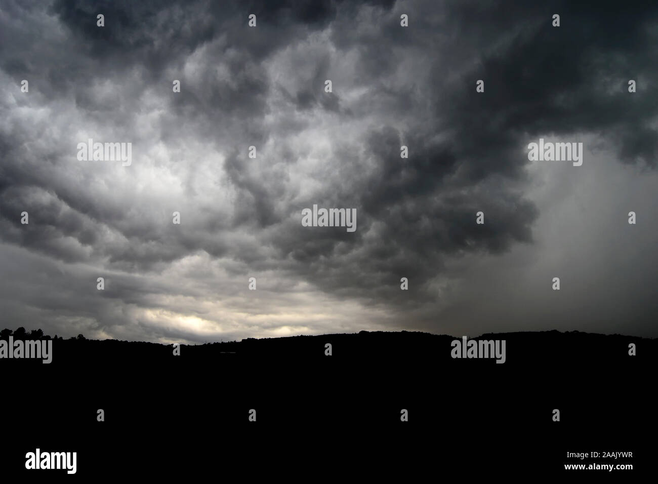 Thunderstorm with heavy rains flying over the dark prairie, time frame Stock Photo