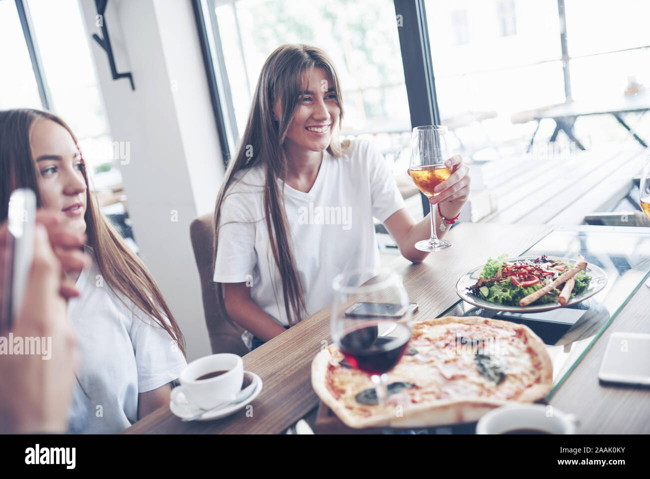 Group of young best friends with pizza and glass of drink celebrating ...
