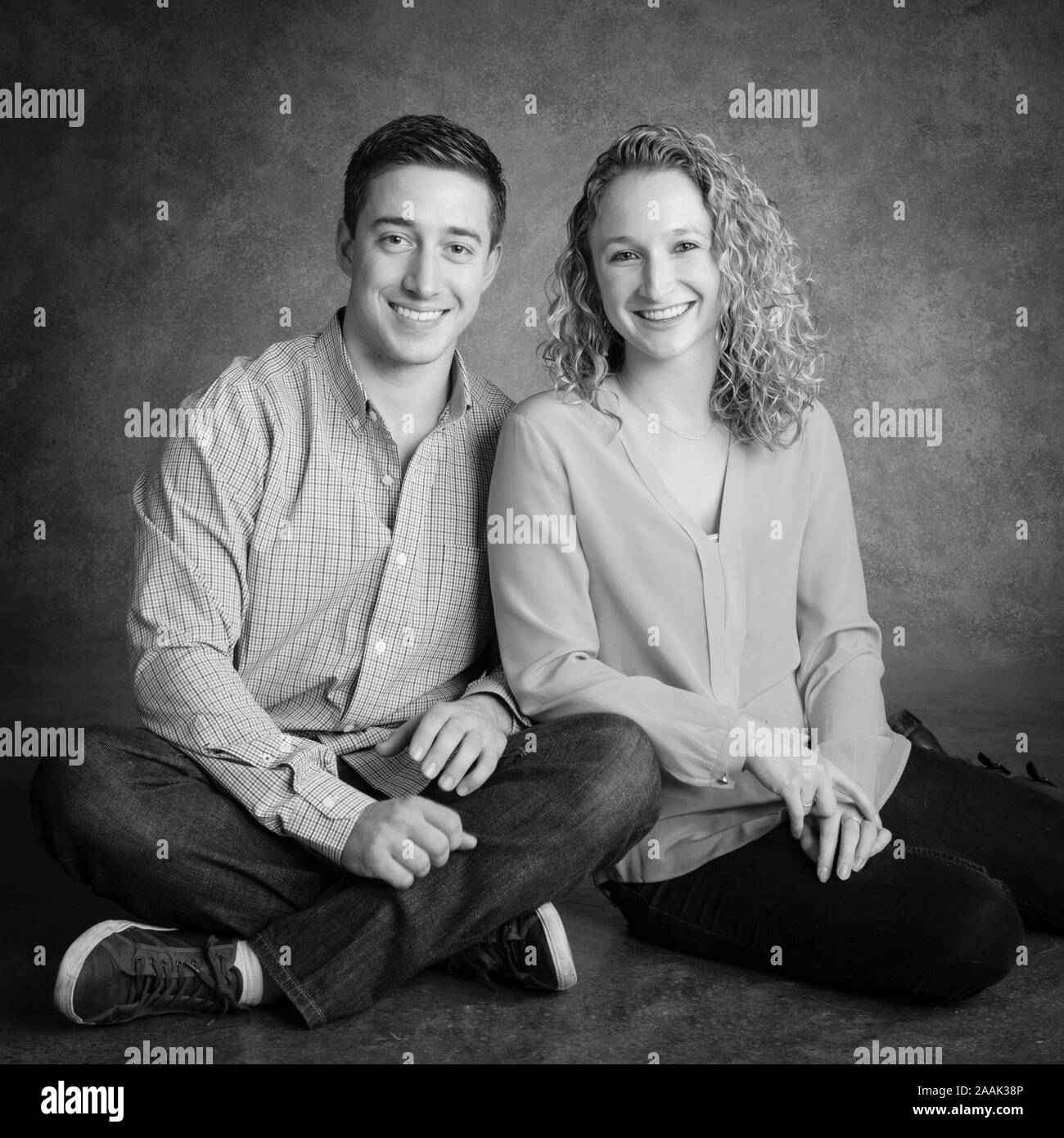 Studio portrait of smiling couple Stock Photo