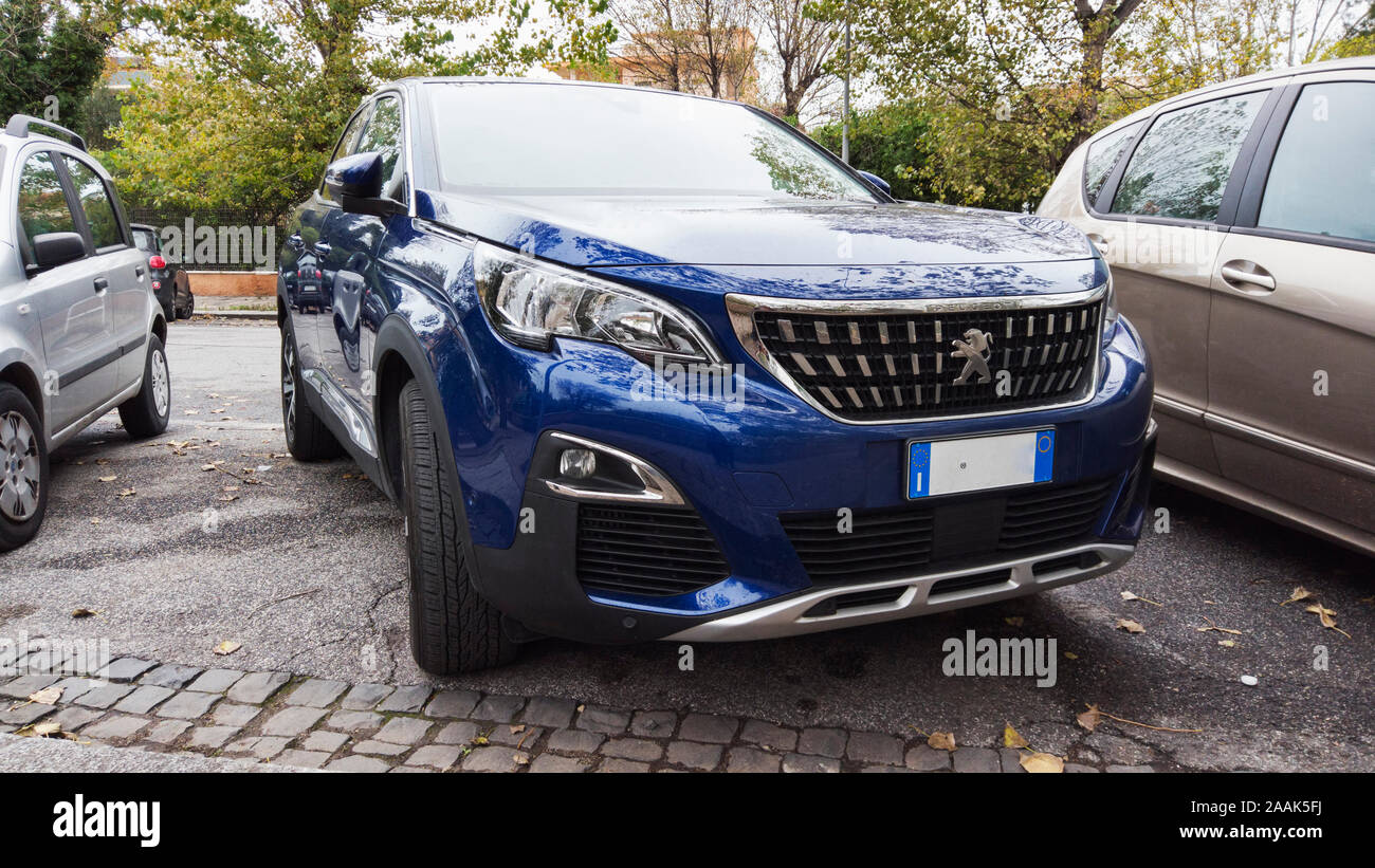 Rome,Italy - November 16, 2019: A blue model of new SUV 5008 from Peugeot automaker parked on the street in a autumn day Stock Photo