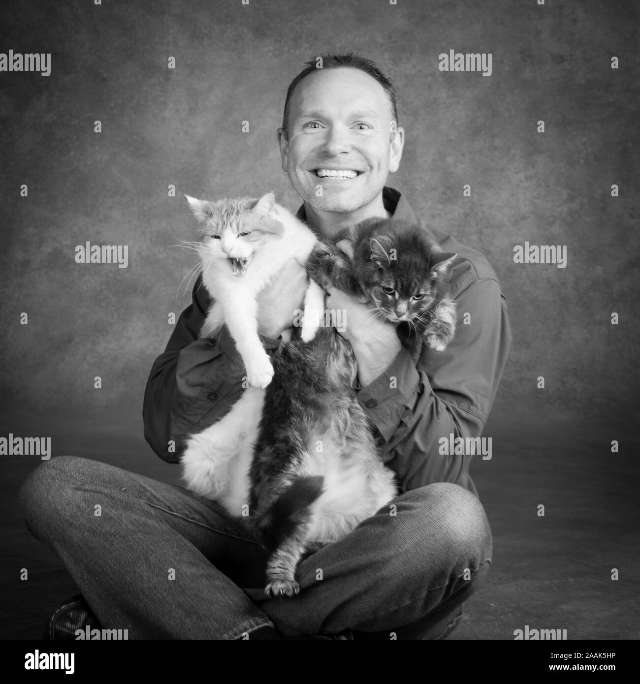 Man holding cat hires stock photography and images Alamy