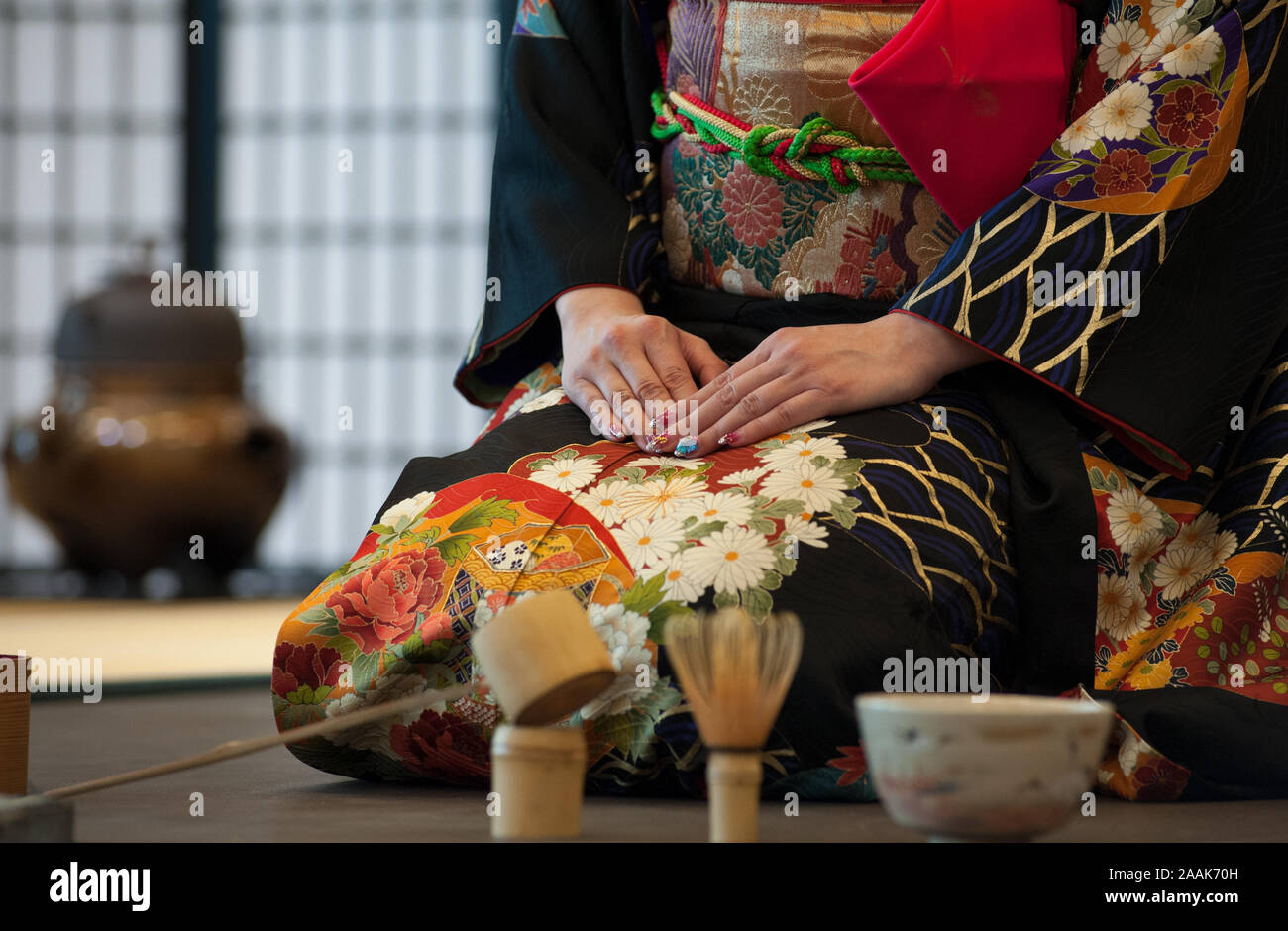 Japanese woman in traditional kimono, during the tea ceremony. Stock Photo
