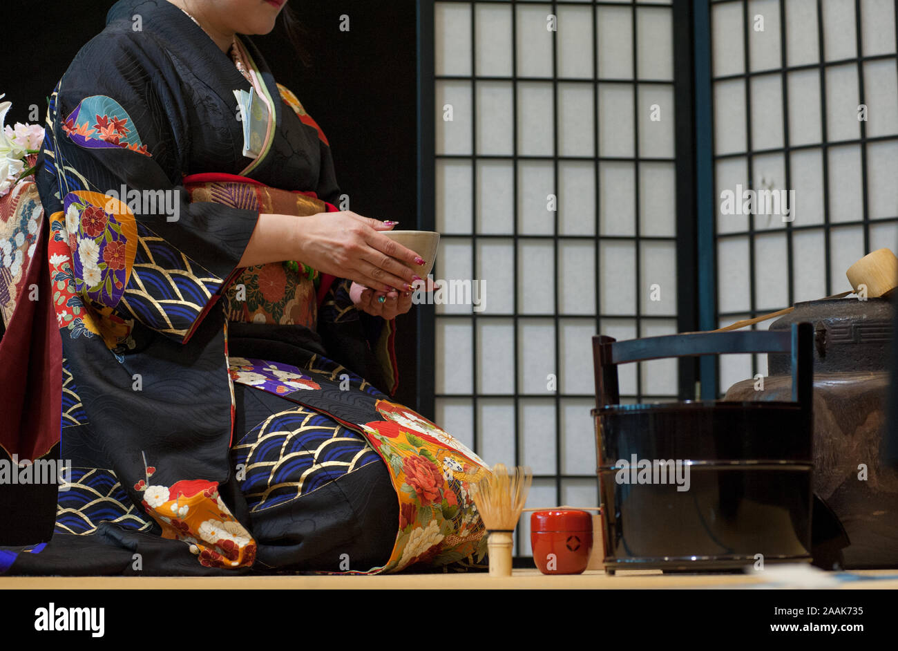 Japanese woman in traditional kimono, during the tea ceremony. Stock Photo