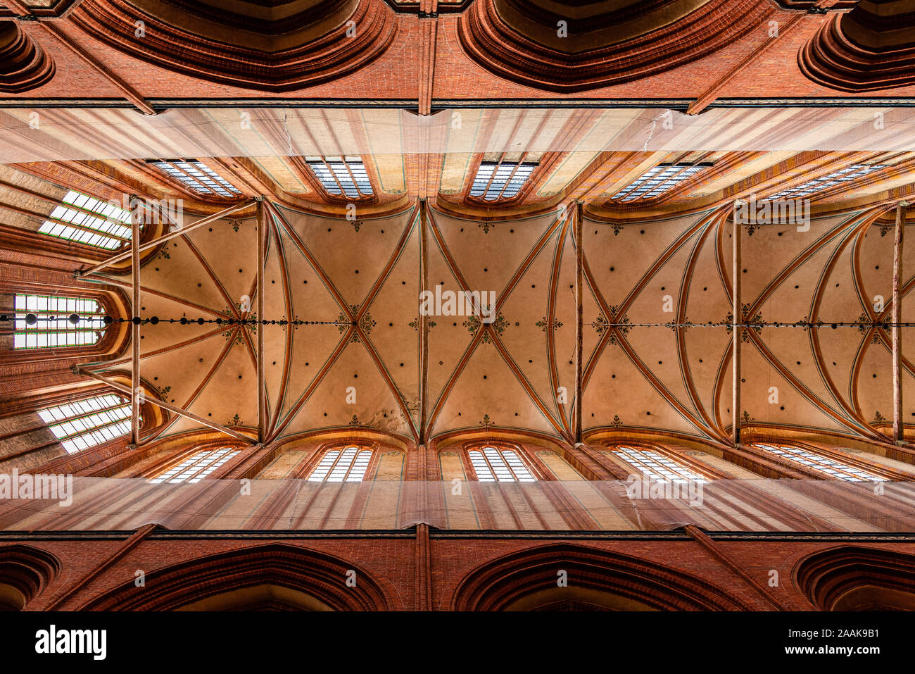 Wismar, Germany - August 2, 2019: Church of St. Nicholas. Interior view directly below the vaults of the main nave Stock Photo