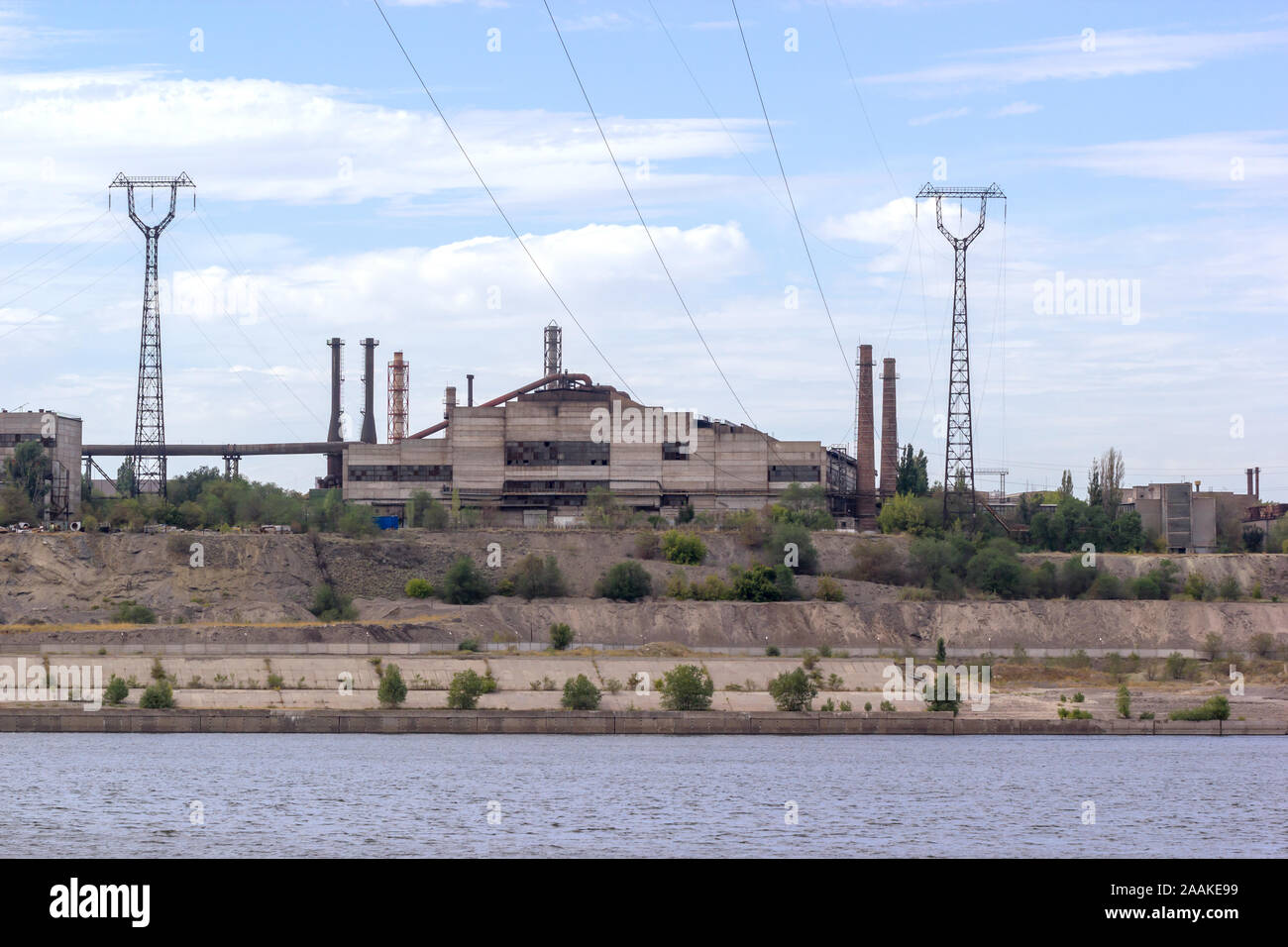 Panoramic view of ironworks located on the river coastline. Industrial landscape. Stock Photo