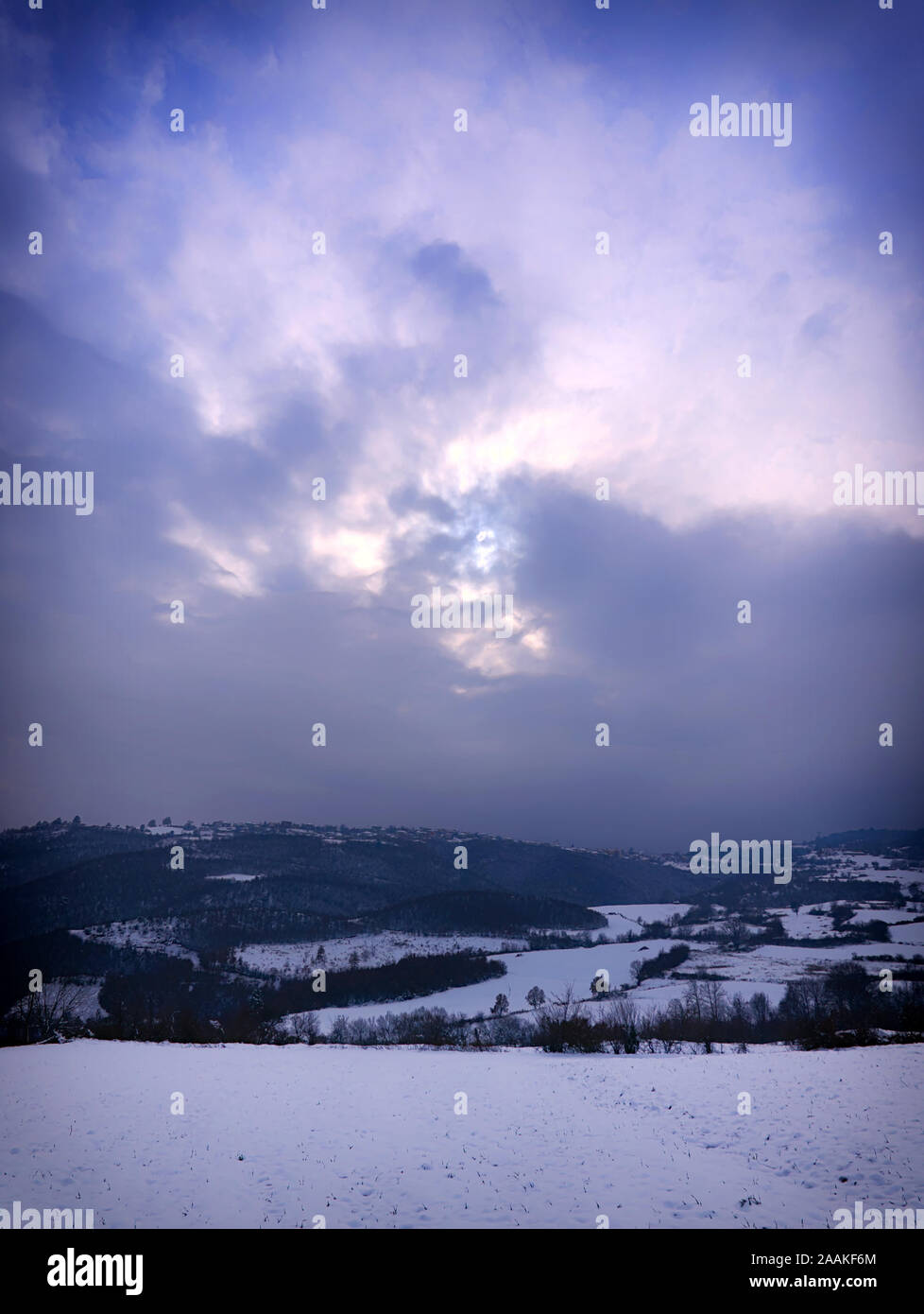 Dreamy colorful winter landscape. Mountains and land covered in snow, Pieria, Greece. Stock Photo