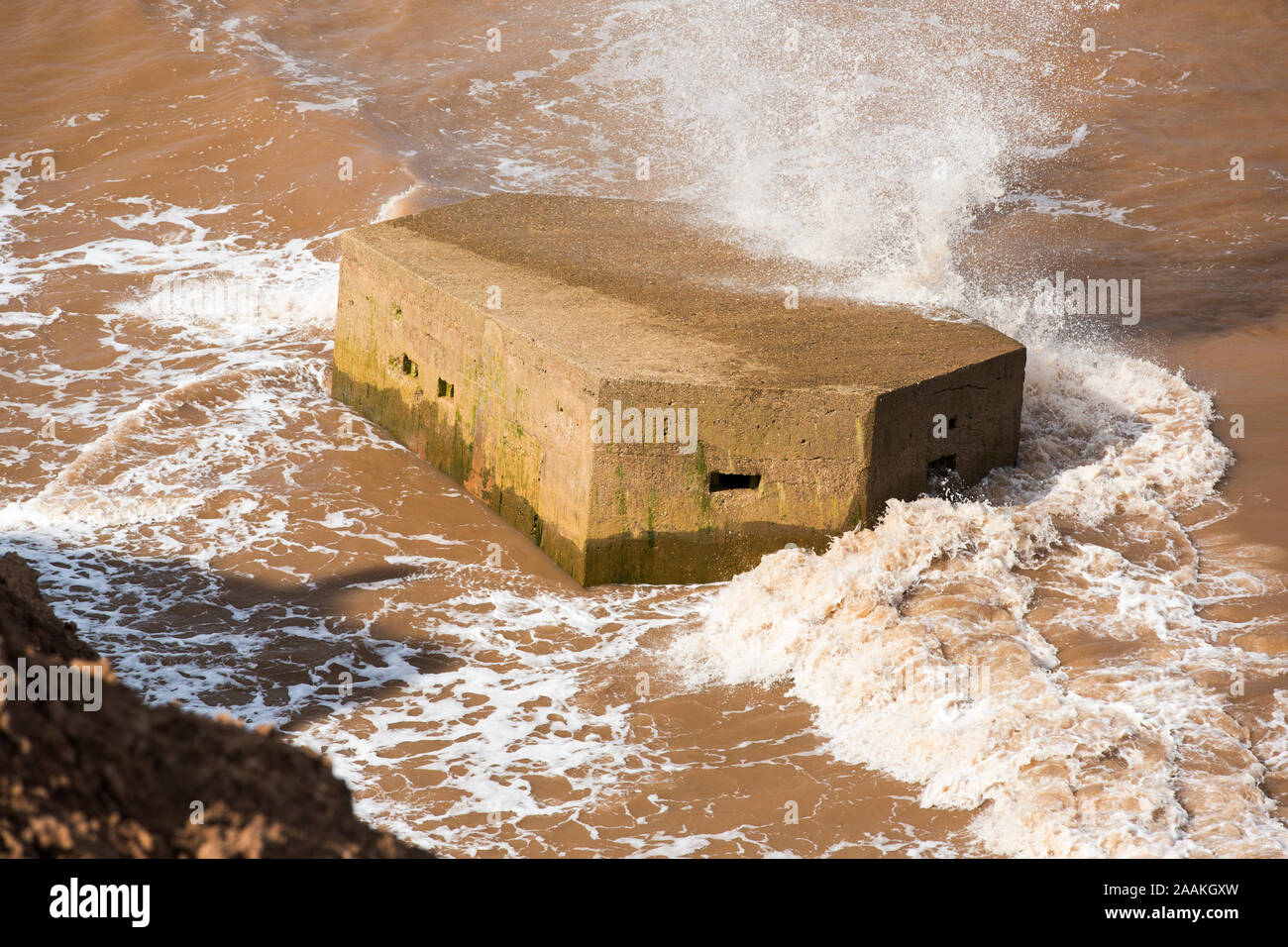 A Second world War Pill box on the beach near Aldbrough on Yorkshires East Coast, UK. It was originally constructed on the cliff tops but has collapse Stock Photo