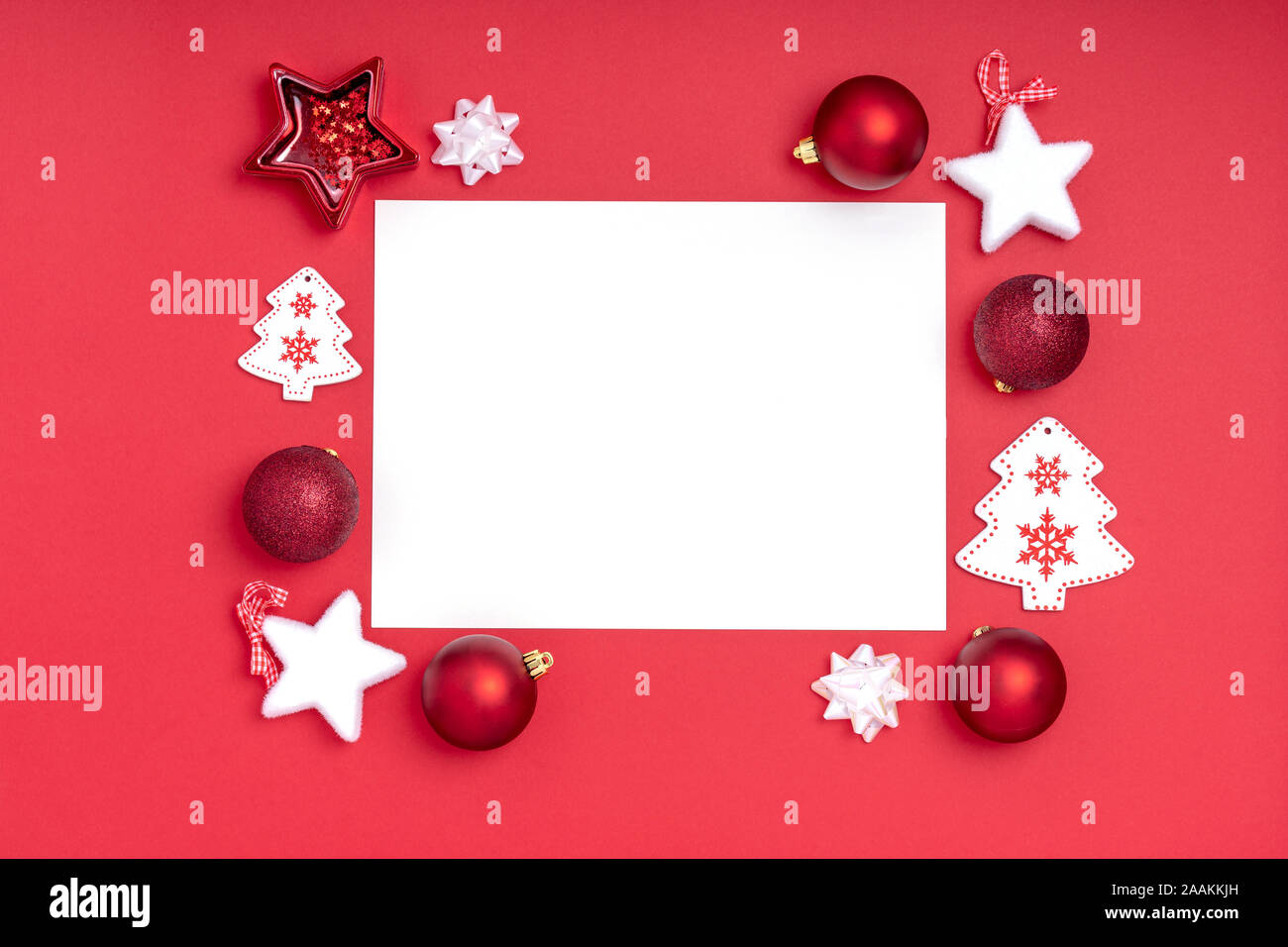 New Year and Christmas frame composition. Blank sheet of paper with  christmas decorations on red background. Top view, flat lay, copy space.  Template design invitation card Stock Photo - Alamy