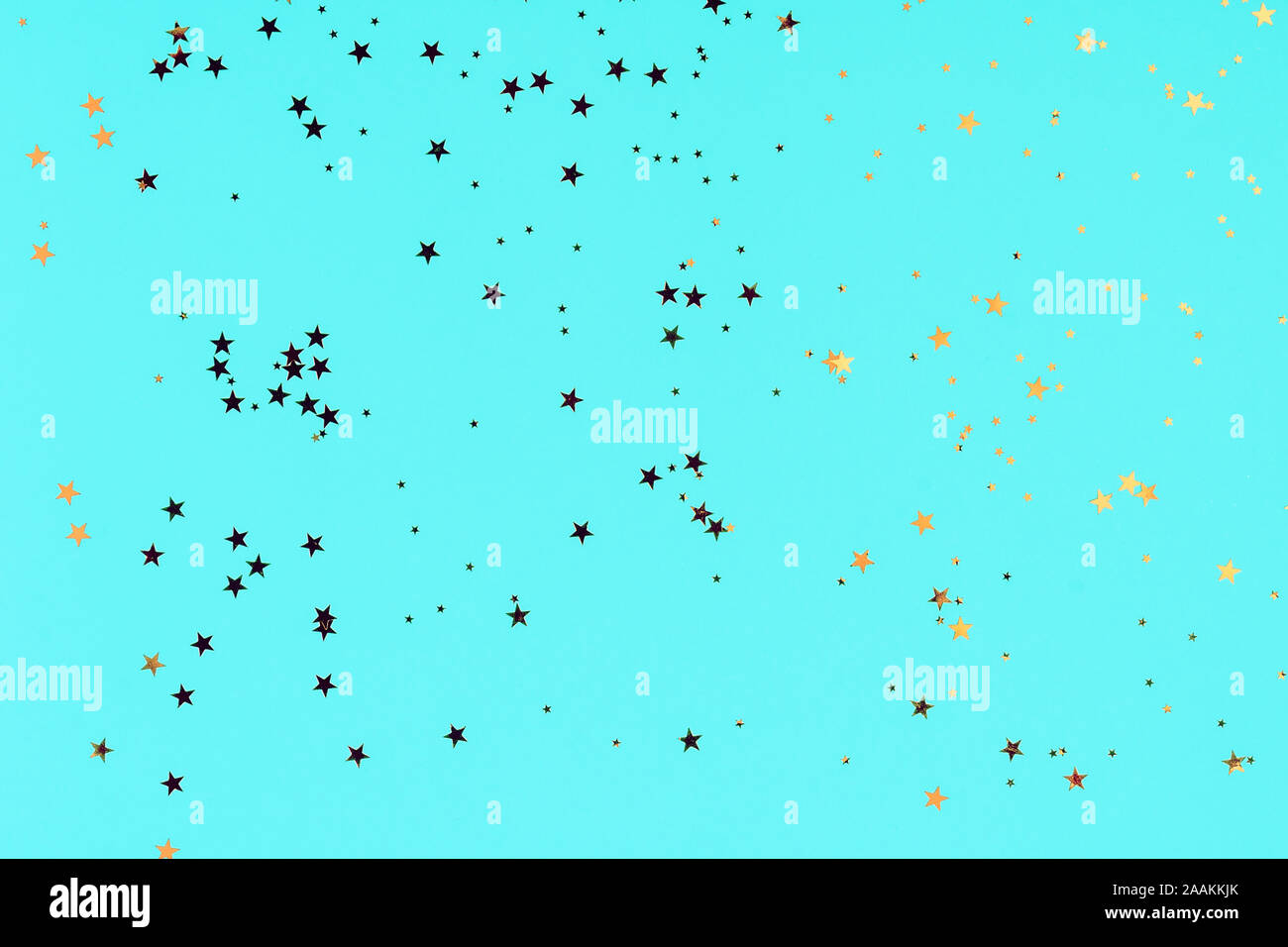 Golden stars glitter confetti in abstract style on blue background ...