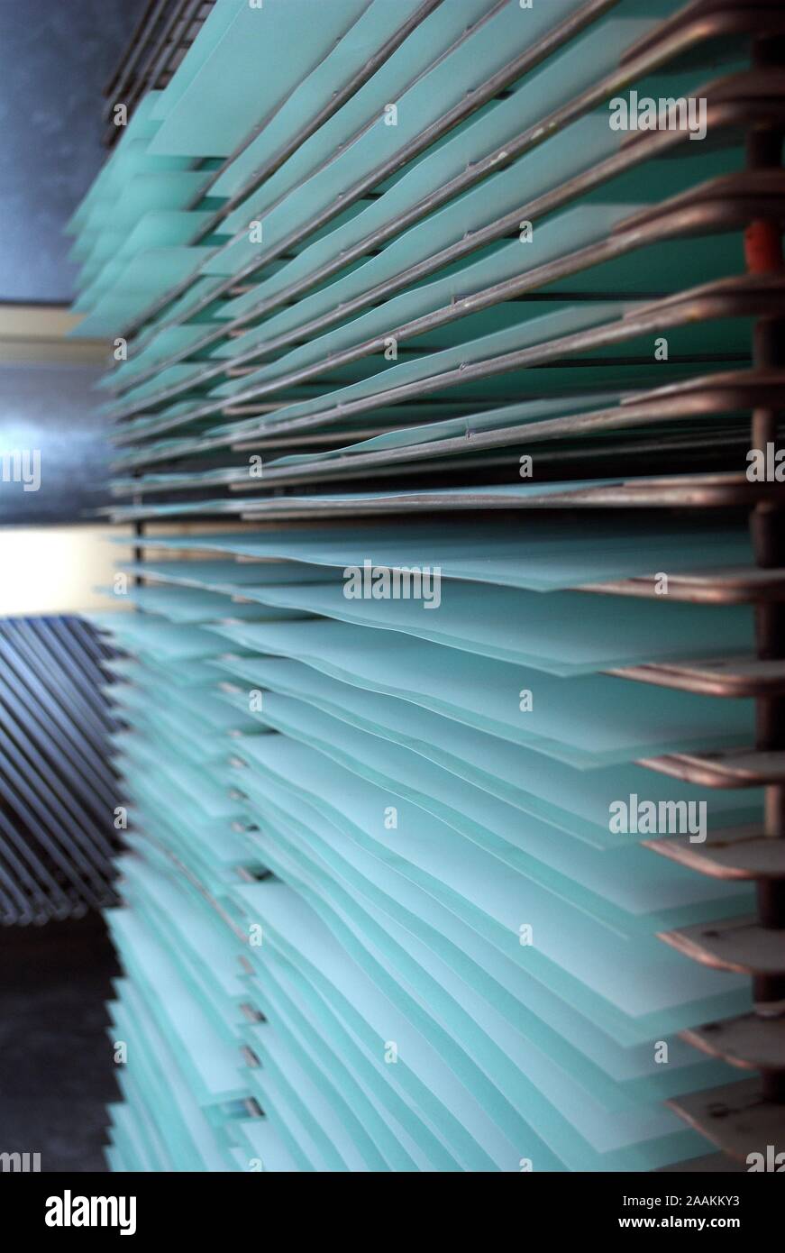 printers rack full of drying screen printed sheets Stock Photo Alamy