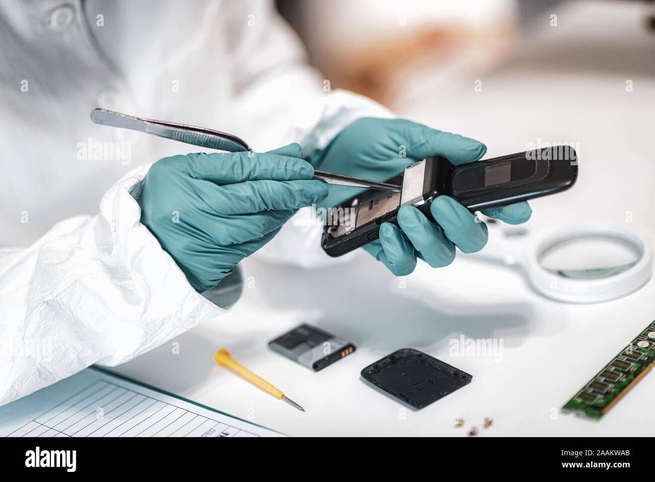 Digital forensic science. Police forensic analyst examining confiscated