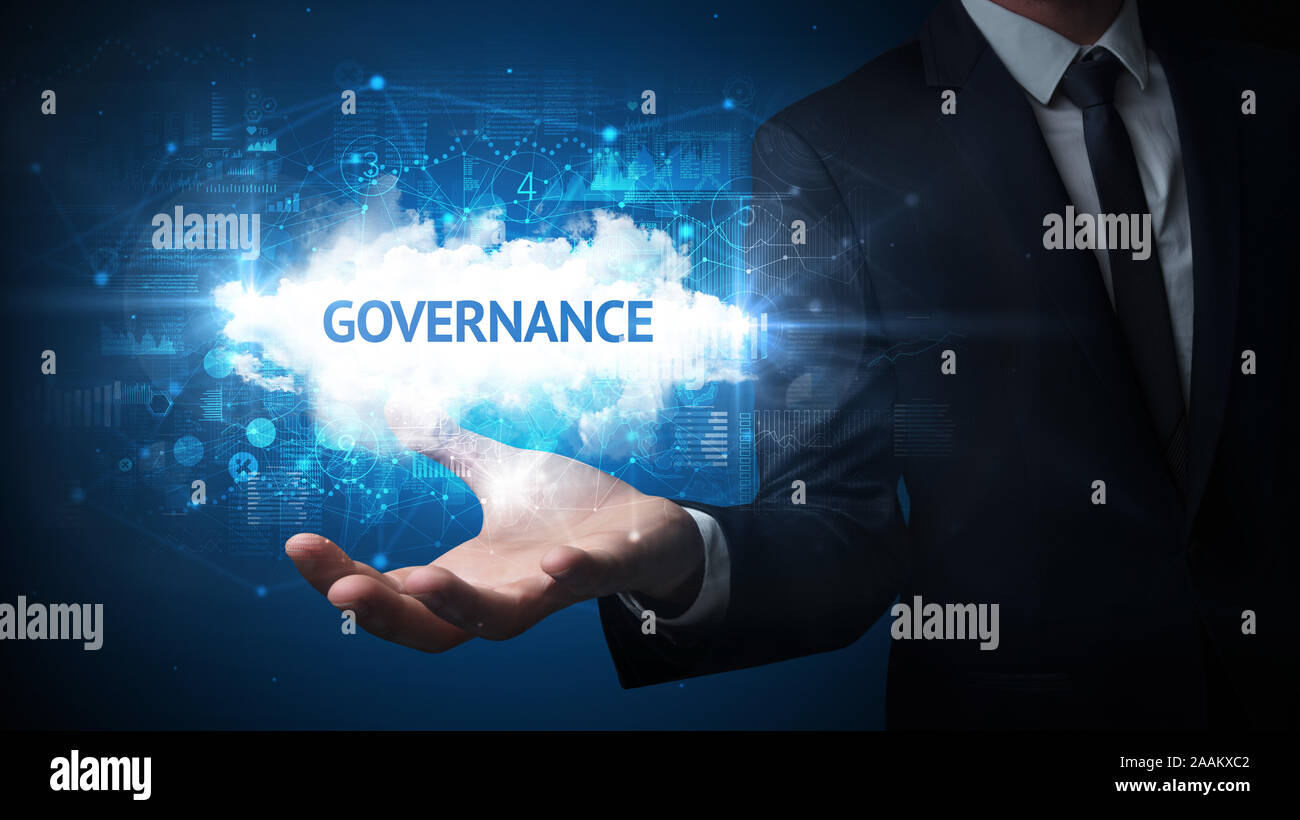View of Hand of Businessman holding GOVERNANCE inscription, successful business ...