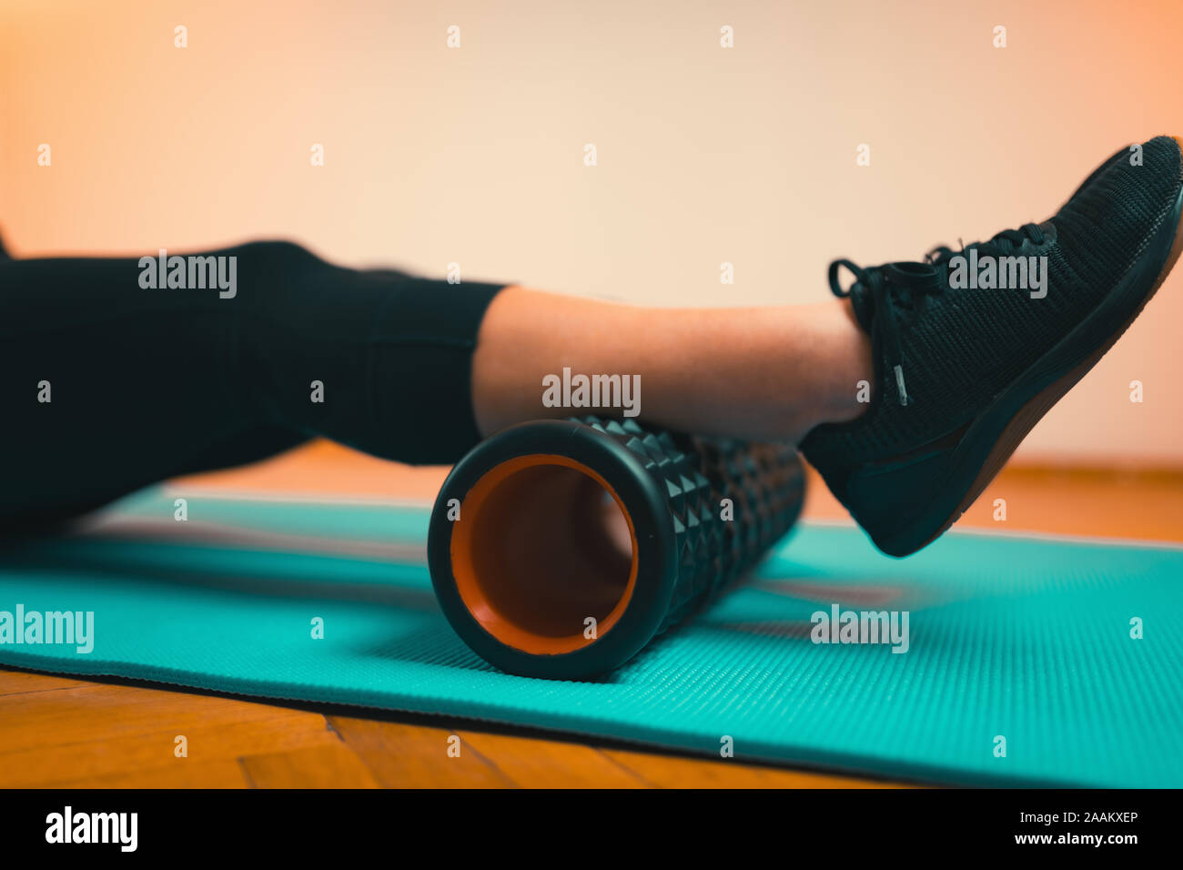Woman using foam roller for fascia and muscle massage Stock Photo Alamy