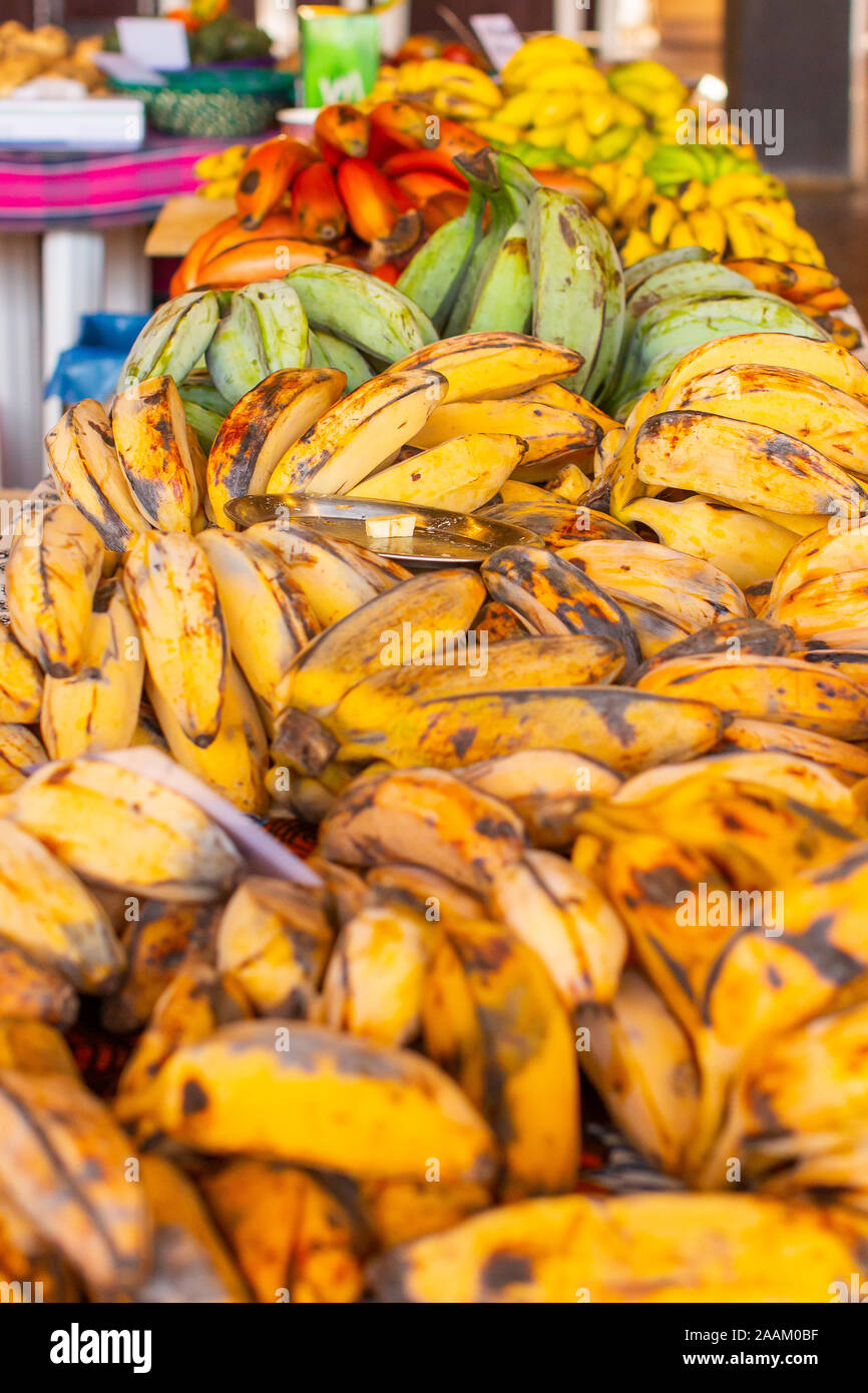 Different types and species of banana. Red, yellow, green bananas in the asian supermarket. Stock Photo