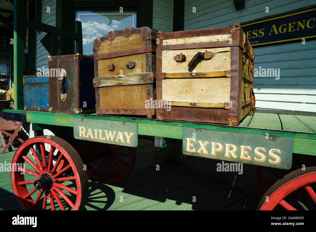 Antique baggage cart loaded with  suitcases and trunks displayed at the Gorham Railroad Museum, New Hampshire, USA. Stock Photo