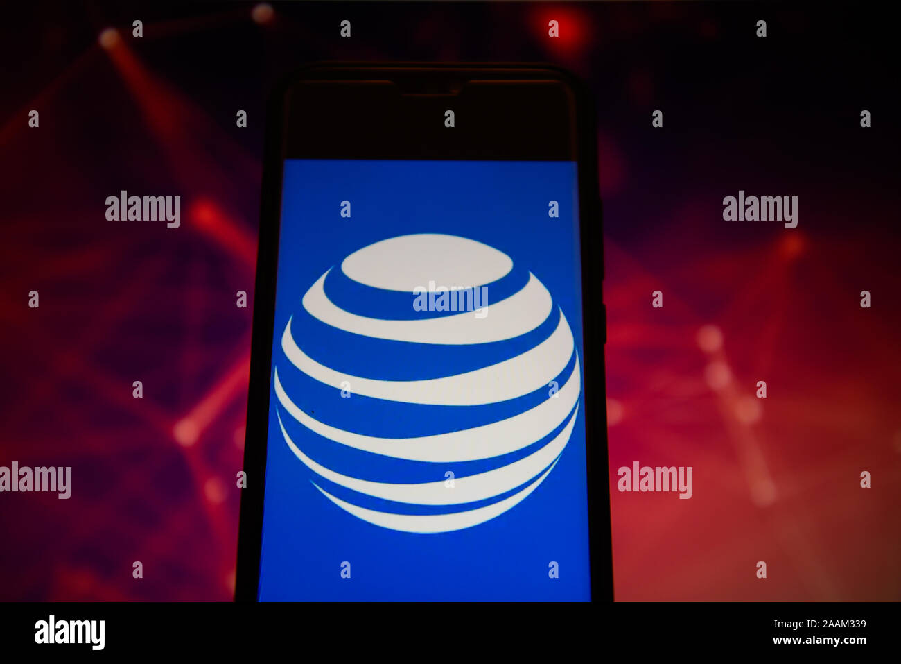 In this photo illustration an AT&T logo seen displayed on a smartphone ...