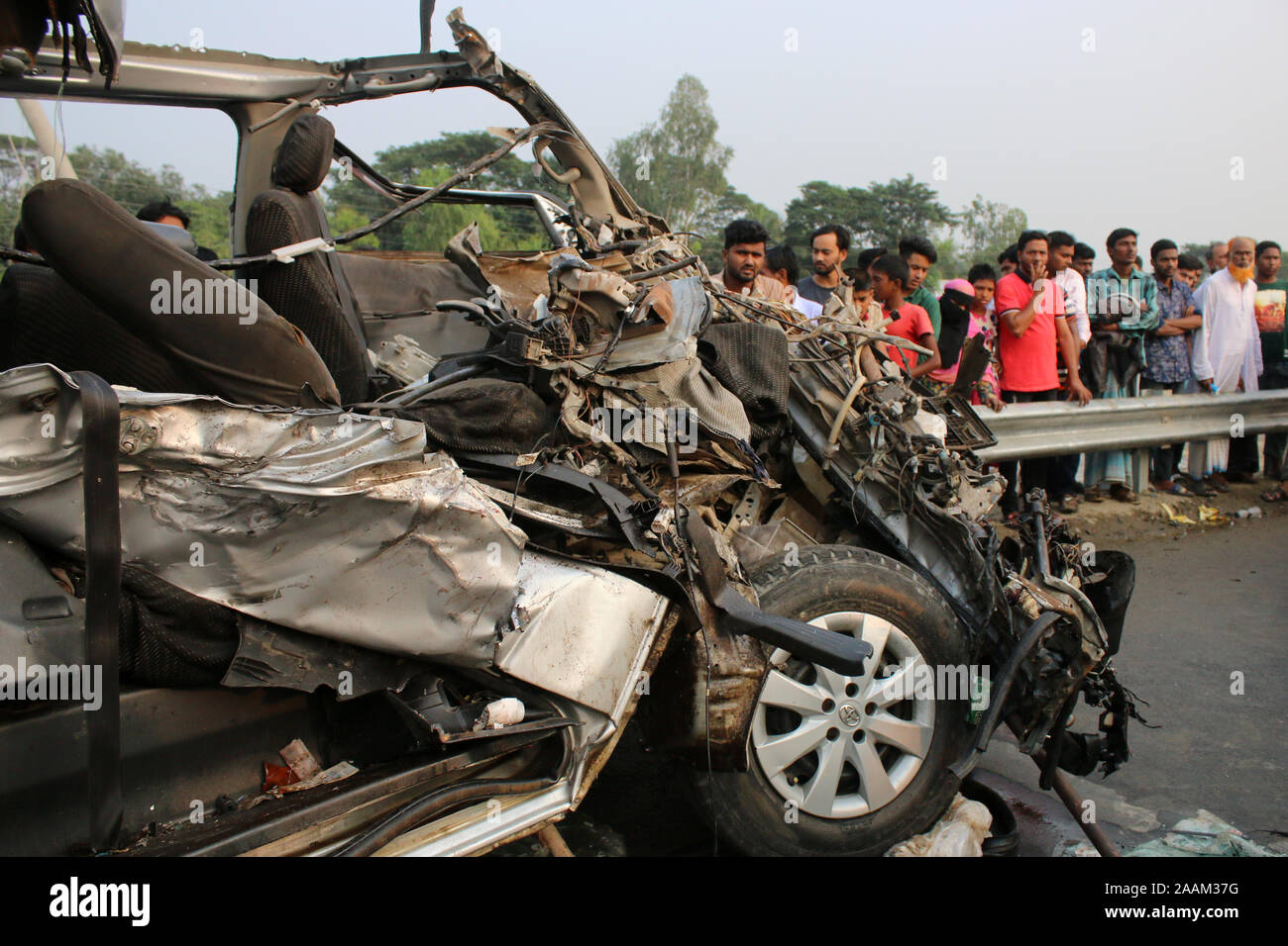 Wreckage of a microbus seen after a bus hit it head-on at the Dhaka-Mawa Highway in Munshiganj.At least ten people, including two women and two children, were killed and four others injured as a bus collides with a microbus. The accident took place on Dhaka-Mawa highway when a microbus carrying a groom’s party was heading towards Dhaka from Munshiganj around 2:00pm. The police official also said that the mishap occurred as the speeding bus of Swadhin Paribahan was overtaking another bus on the road. Stock Photo