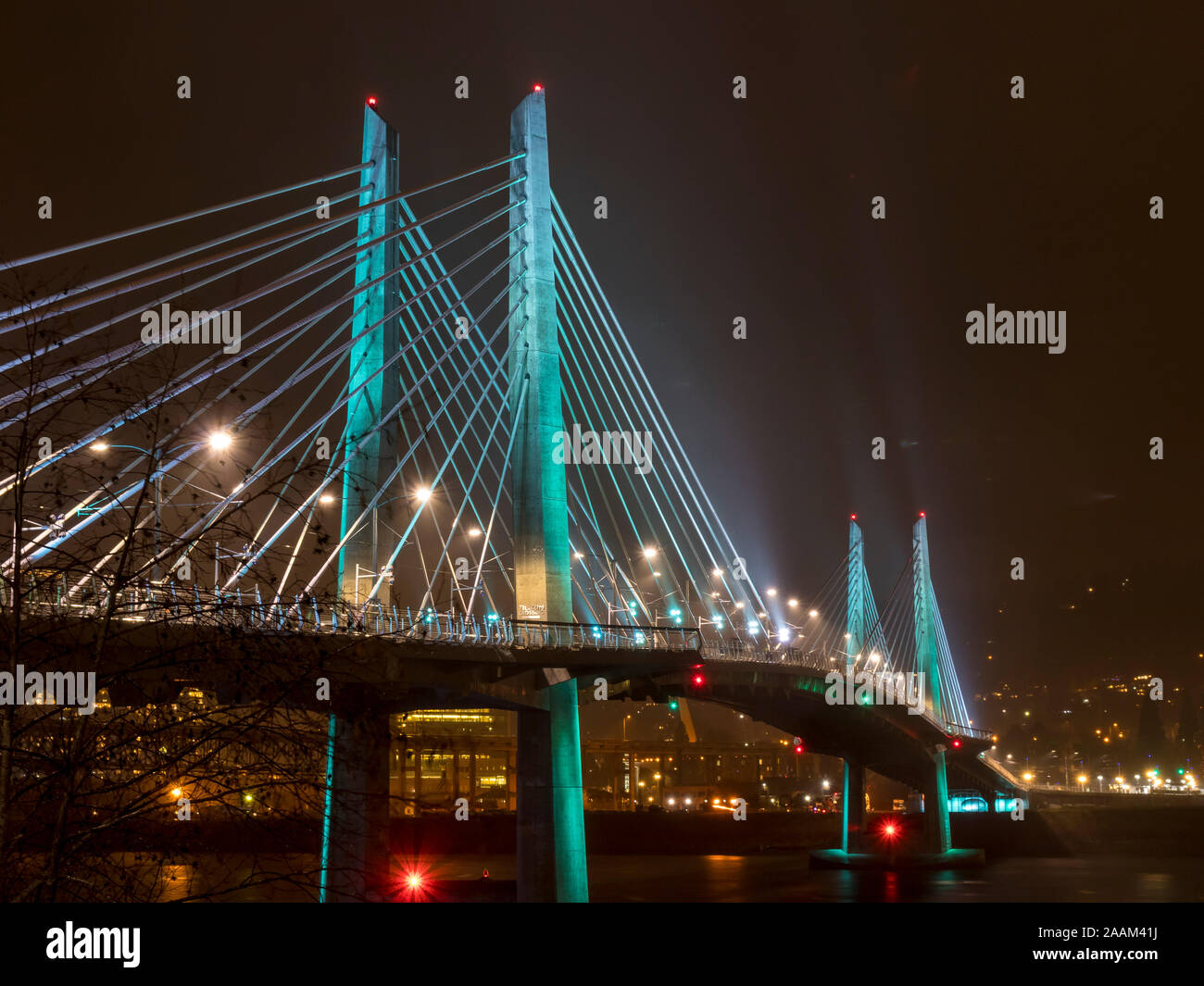 Tilikum Crossing at night in the rain with lights Stock Photo