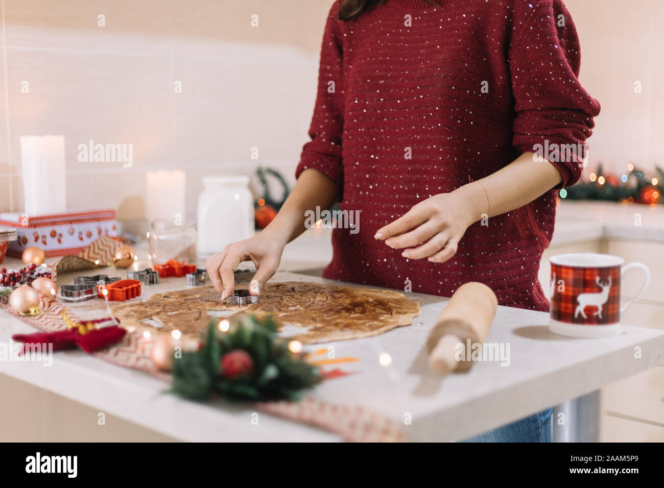 Making angel cookies from gingerbread rollout dough Stock Photo