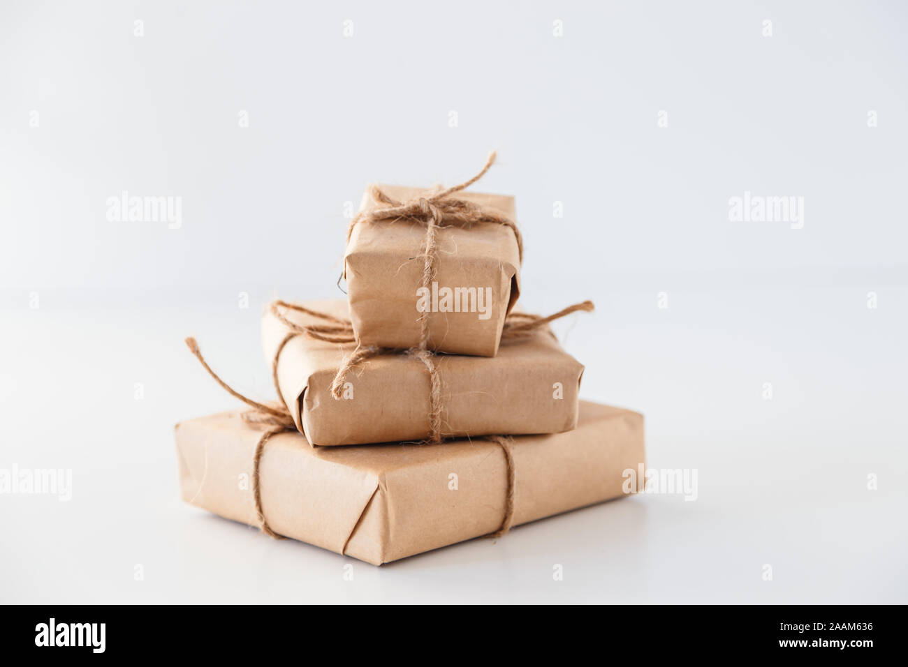 Stack of handcraft gift boxes on white background Stock Photo