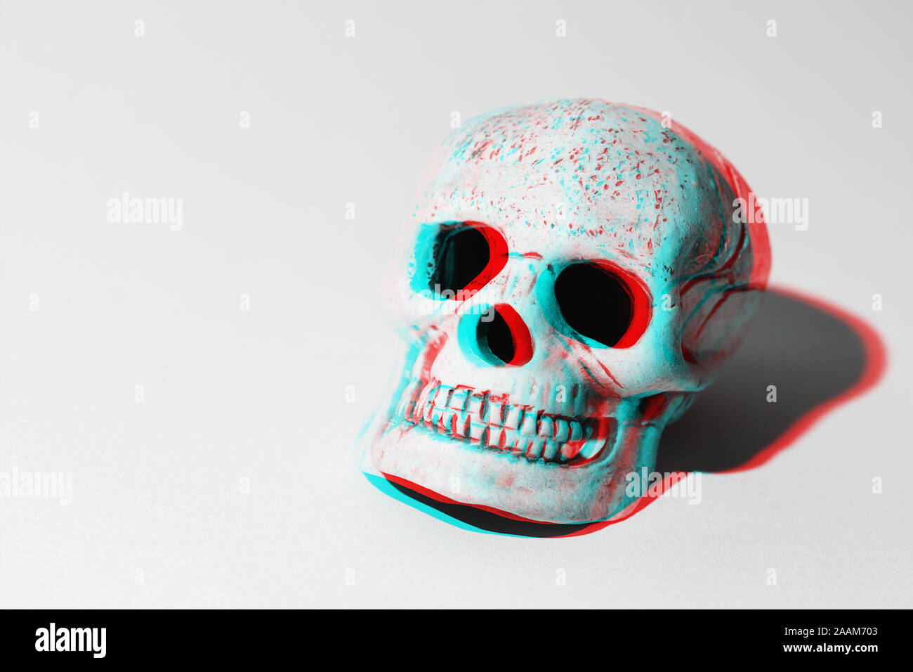 3D skull with shadows on grey background Stock Photo