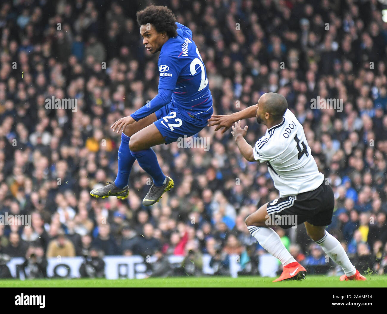 LONDON, ENGLAND - MARCH 3, 2019: Willian Borges da Silva of Chelsea and Denis Odoi of Fulham pictured during the 2018/19 Premier League game between Fulham FC and Chelsea FC at Craven Cottage. Stock Photo