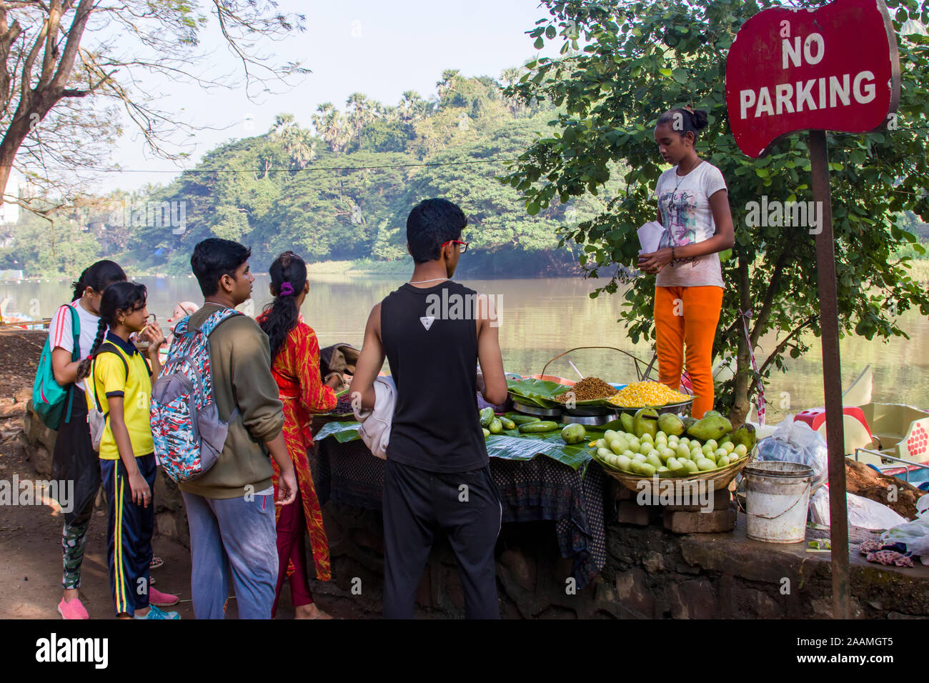 tourists are buying snack from food and fruit stall in Sanjay Gandhi National Park. It is one of the major national parks existing within a metropolis Stock Photo