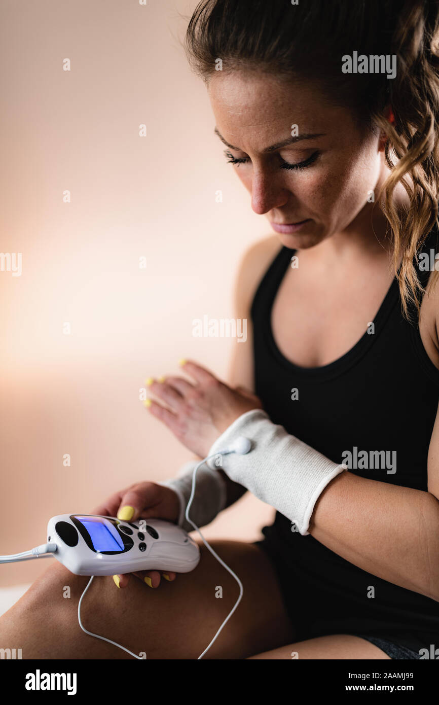 Physical therapy with TENS machine Stock Photo - Alamy