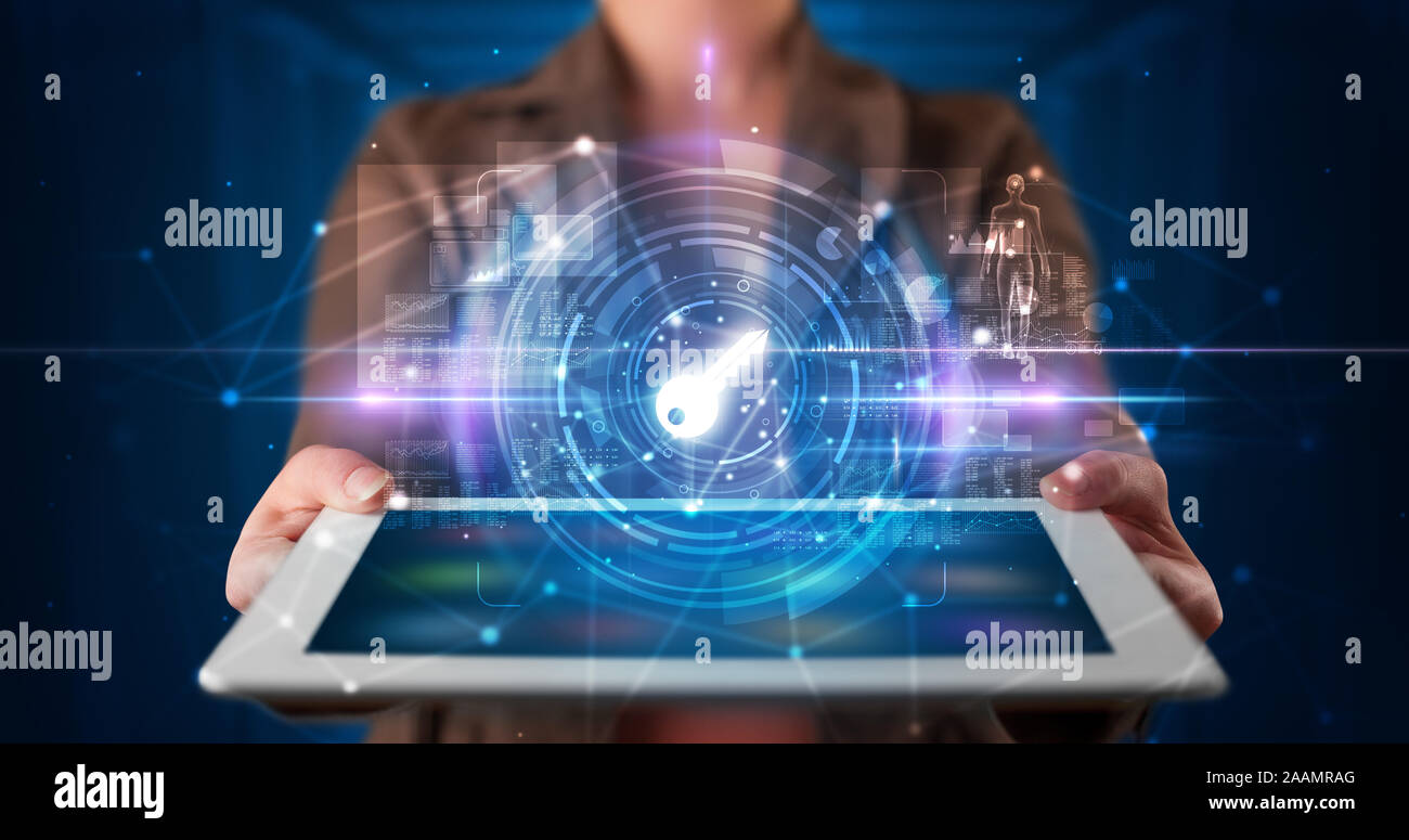 Hand holding tablet with online security and data protection concept ...