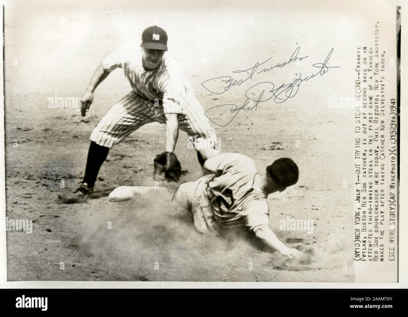 Vintage autographed AP Wirephoto of New York Yankees infielder Phil Rizzuto tagging a runner out at second base circa 1941. Stock Photo