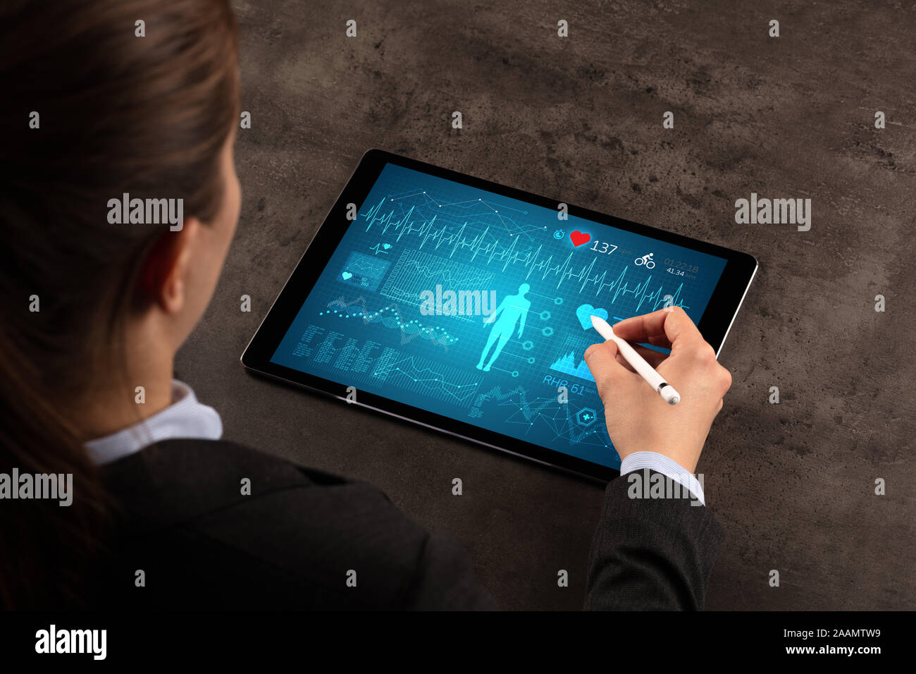 Business woman making healthy analysis on tablet Stock Photo